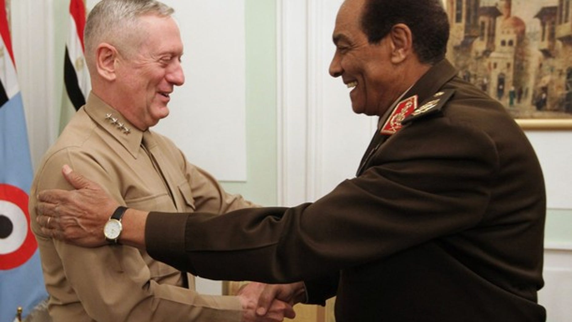 FILE: Egypt's Armed Forces Supreme Council head Field Marshal Hussein Tantawi (R) shakes hands with the U.S. Commander of the Central Command James Mattis as he arrives for a meeting in Cairo.