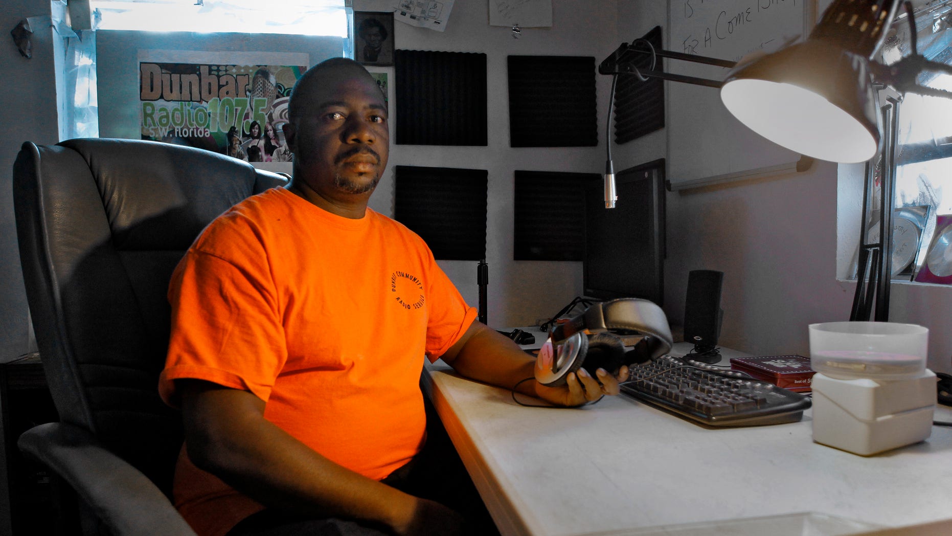January 5: Albert Knighten sits in his darkened radio studio at his home in Fort Myers, Fla. The Federal Communications Commission shut down the pirate radio station and arrested Knighten.