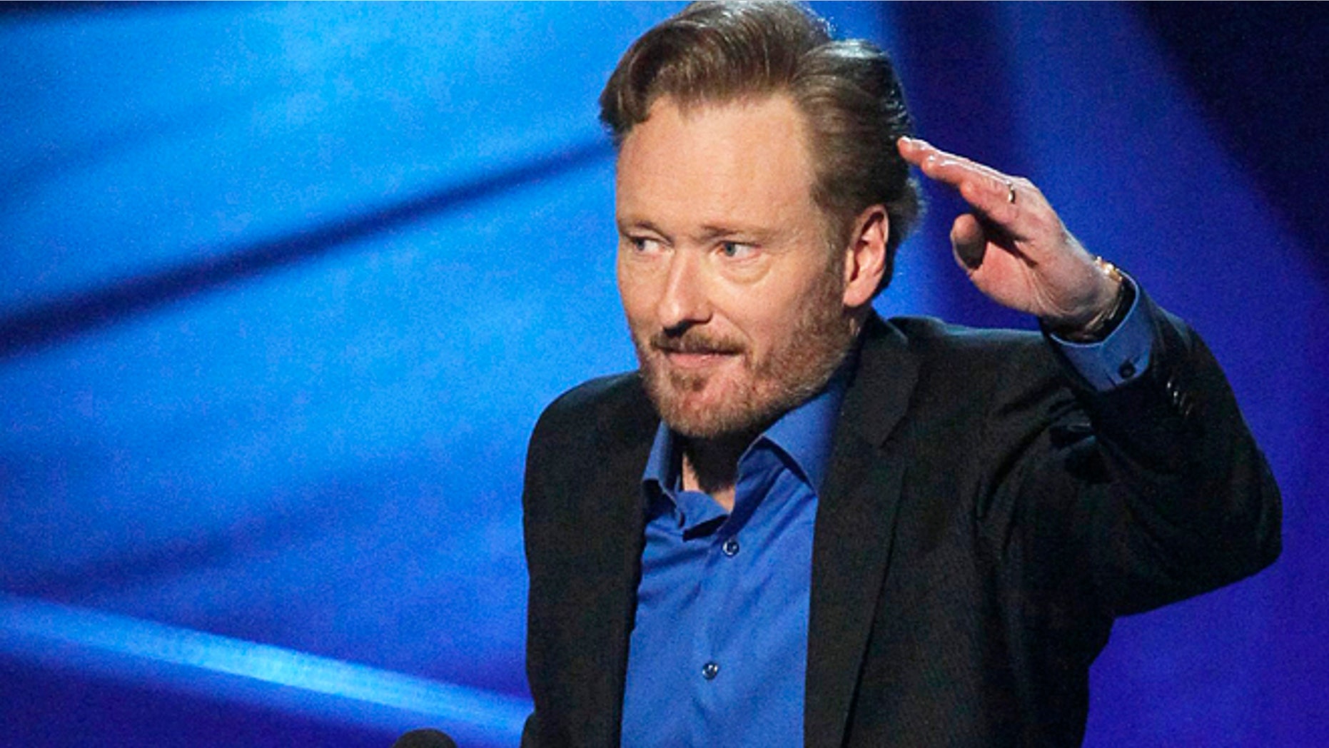 Conan O'Brien accepts the award for favorite talk show host at the 2011 People's Choice Awards in Los Angeles January 5, 2011.