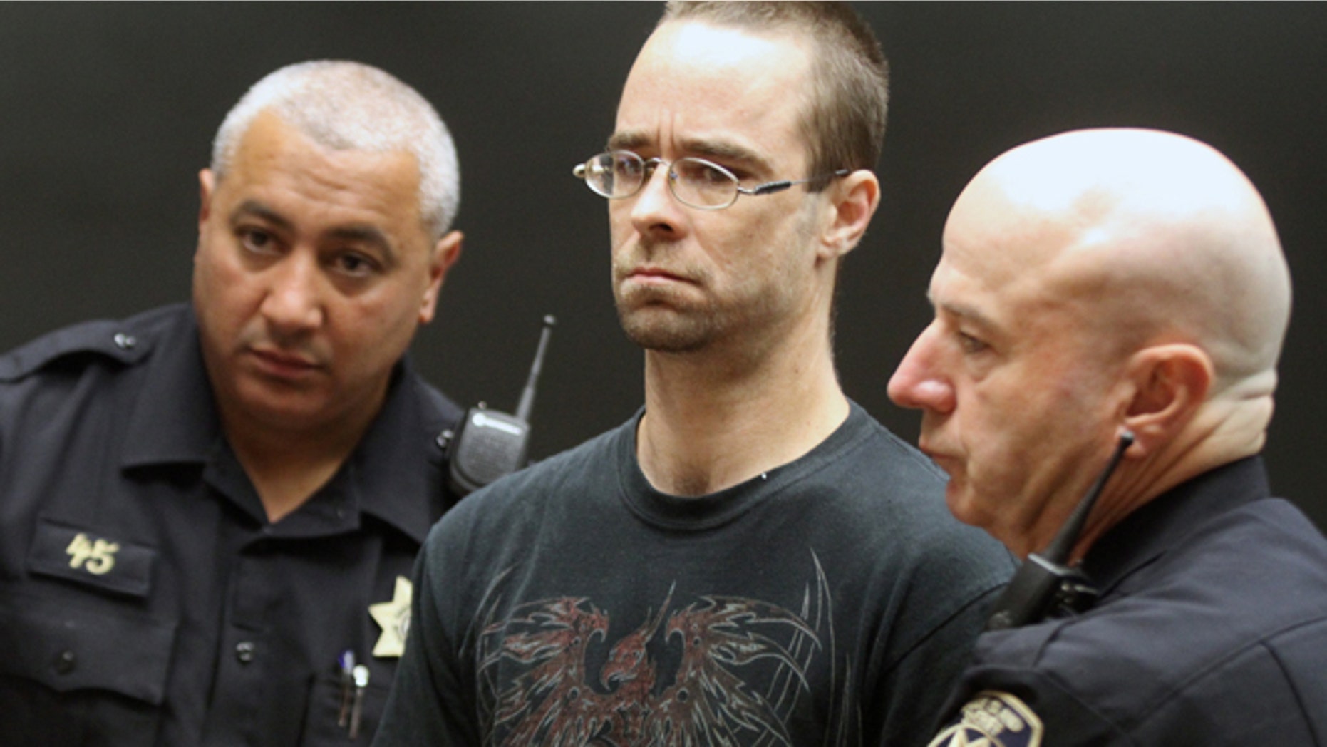 MAY 29: Steven Pietrowicz, Jr., center, of Burrillville, R.I., is arraigned on a murder charge in Providence District Court in Providence, R.I., for the murder of Domingo Ortiz of Worcester, Mass., Monday, June 1, 2015. Pietrowicz is one of two people facing murder charges in the death of Ortiz. The body of Ortiz was found Friday, May 29 under newly laid concrete beneath an outside deck of a house in Burrillville, R.I.,where Pietrowicz and Michelle Morin of Worcester, Mass. lived.
