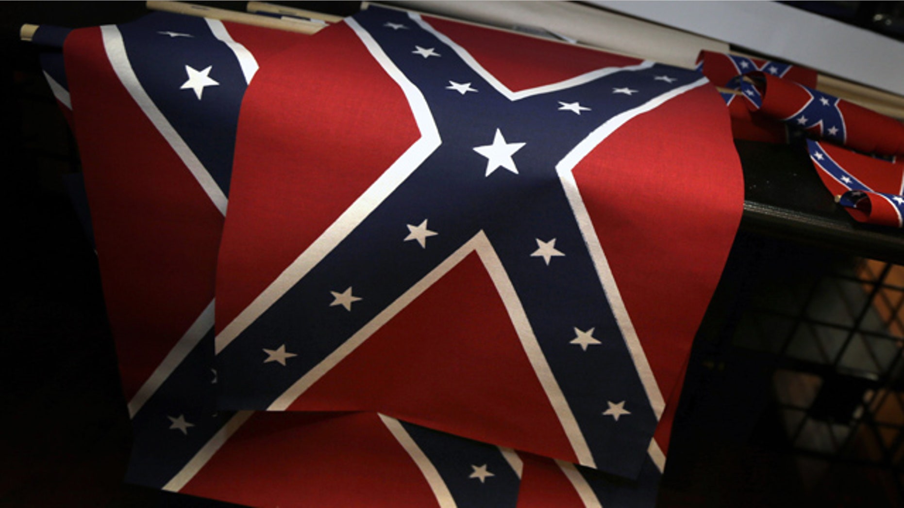June 23, 2015: Small Confederate flags are displayed on a shelf at Arkansas Flag and Banner in Little Rock, Ark. Major retailers including Amazon, Sears, eBay and Etsy and Wal-Mart Stores Inc., are halting sales of the Confederate flag and related merchandise. (AP Photo/Danny Johnston)