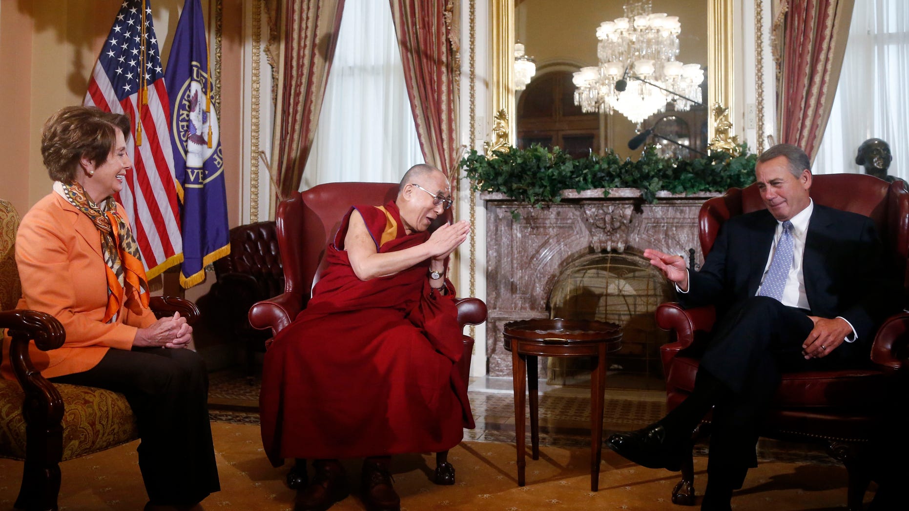 Dalai Lama meets with House Speaker John Boehner and House Minority Leader Nancy Pelosi on Capitol Hill in Washington, Thursday, March 6, 2014. (AP Photo/Charles Dharapak)