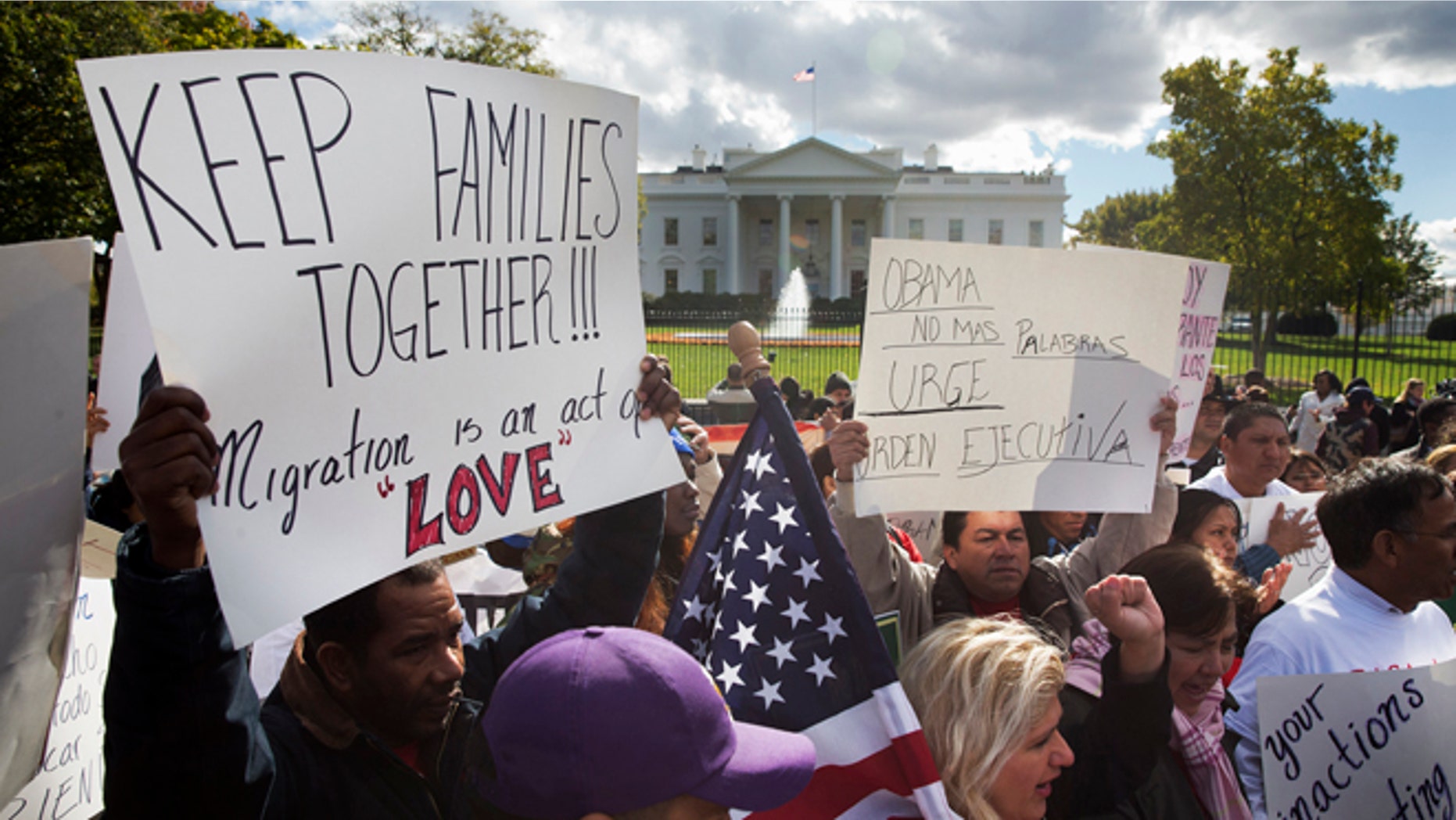 FILE - In this Nov. 7, 2014 file photo, people rally for comprehensive immigration reform outside the White House in Washington. Conservative Republicans want to drag must-pass spending bills into their fight with President Barack Obama over his planned executive action on immigration, inviting comparisons to last years shutdown showdown over the health care law. In the Senate, Jeff Sessions of Alabama and Mike Lee of Utah are among those arguing to use an upcoming must-pass spending bill _ either in December or next year _ to try to block Obama from taking unilateral action to protect millions of immigrants here illegally from deportation. (AP Photo/Jacquelyn Martin, File)