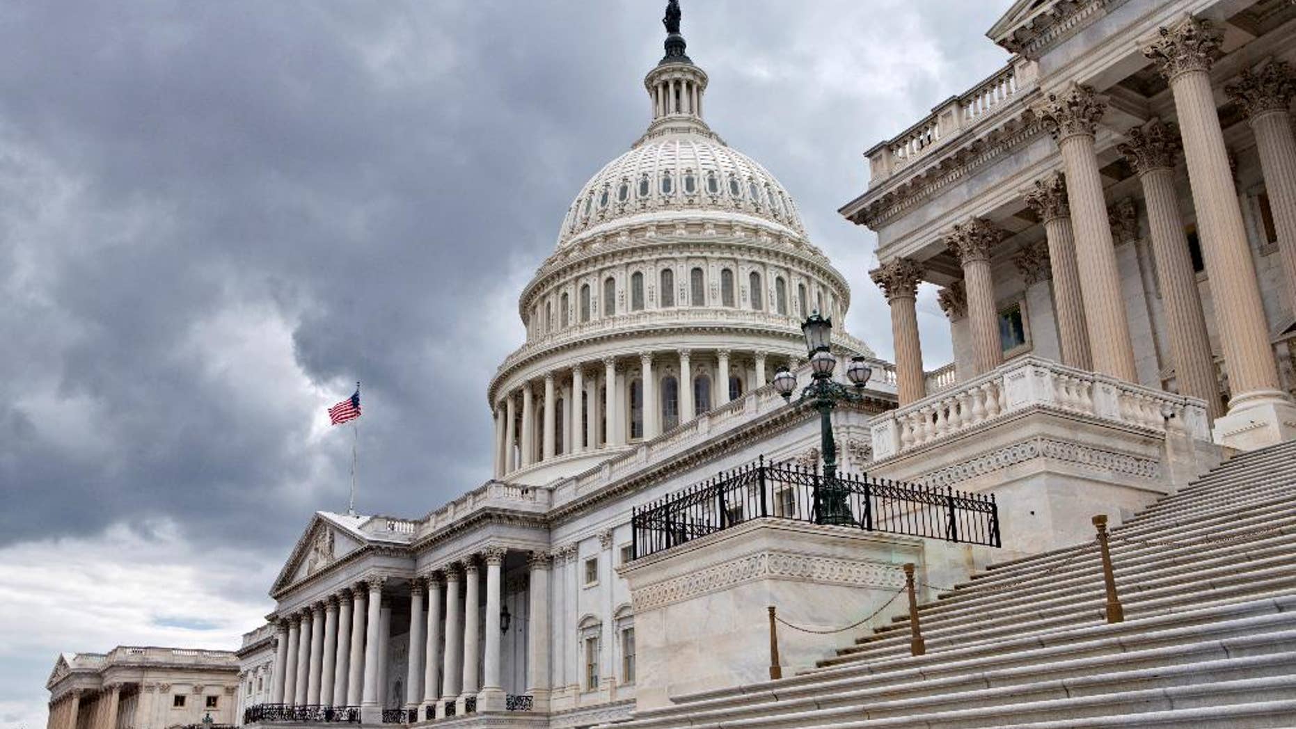 This photo taken July 23, 2013, show the U.S. Capitol in Washington. Congress returns to work this week with a relatively short and simple agenda, vote to keep the government operating in the short term, then return home to campaign. National security threats from Islamic State militants and Russian aggression in Ukraine loom large, but September's session may be too short for lawmakers to do anything but talk about them. (AP Photo/J. Scott Applewhite)
