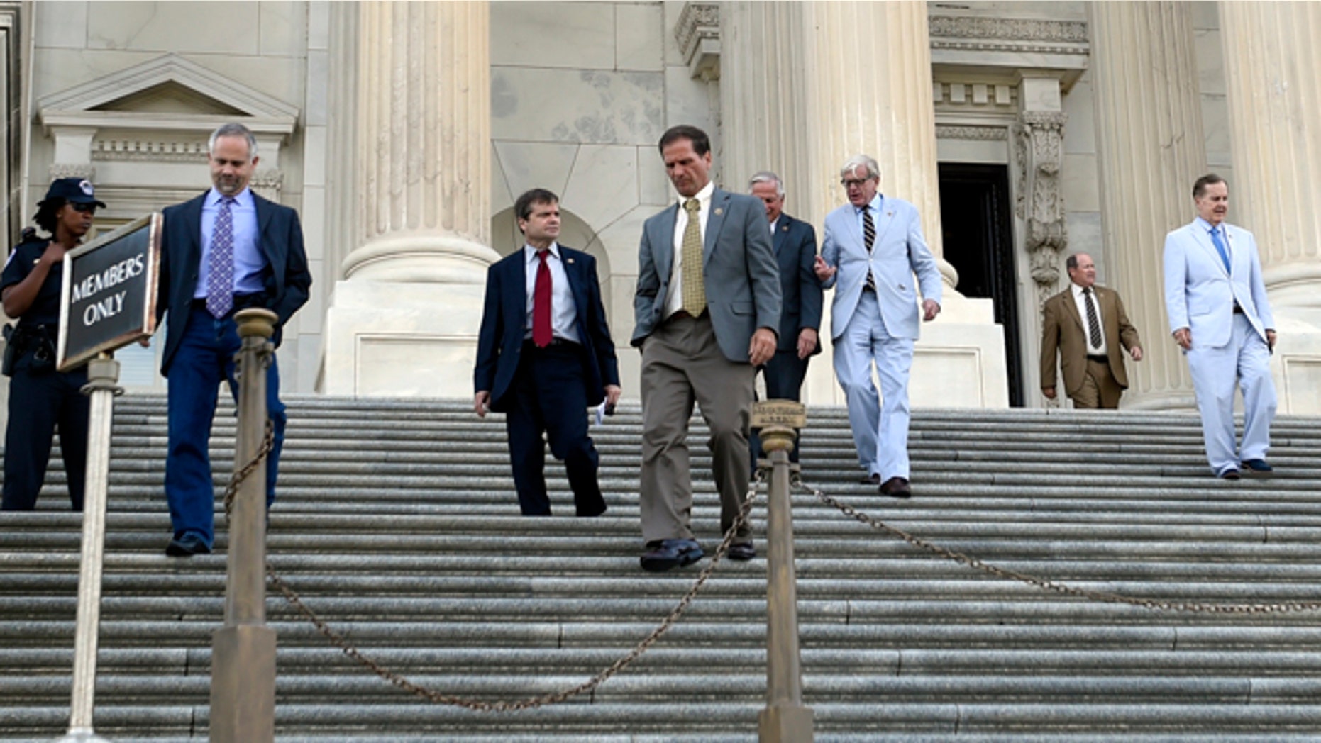 FILE: July 29, 2015: House members walk down the steps on Capitol Hill in Washington, D.C.