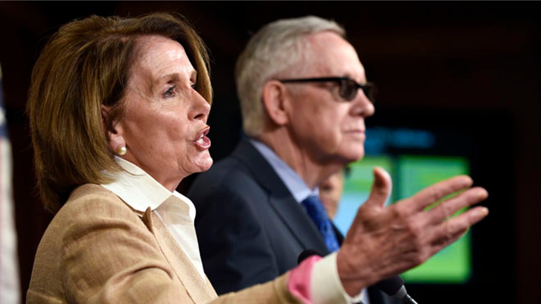 FILE: June 25, 2015: House Minority Leader Nancy Pelosi of Calif., and Senate Minority Leader Harry Reid, of Nev., on Capitol Hill, Wash., D.C.