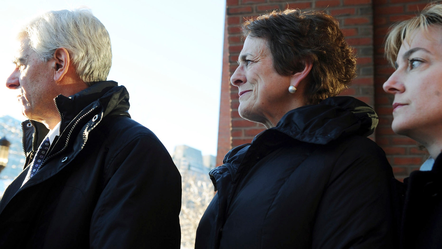 Jan. 13: Patrice Tierney, center, wife of state Rep. John Tierney, is flanked by her lawer Donald Stern. left, and her spokesperson Jennifer Flagg, right, as she leaves federal court in Boston. Patrice Tierney was sentenced to 30 days in prison for tax charges related to helping her brother conceal income from an illegal offshore gambling business.