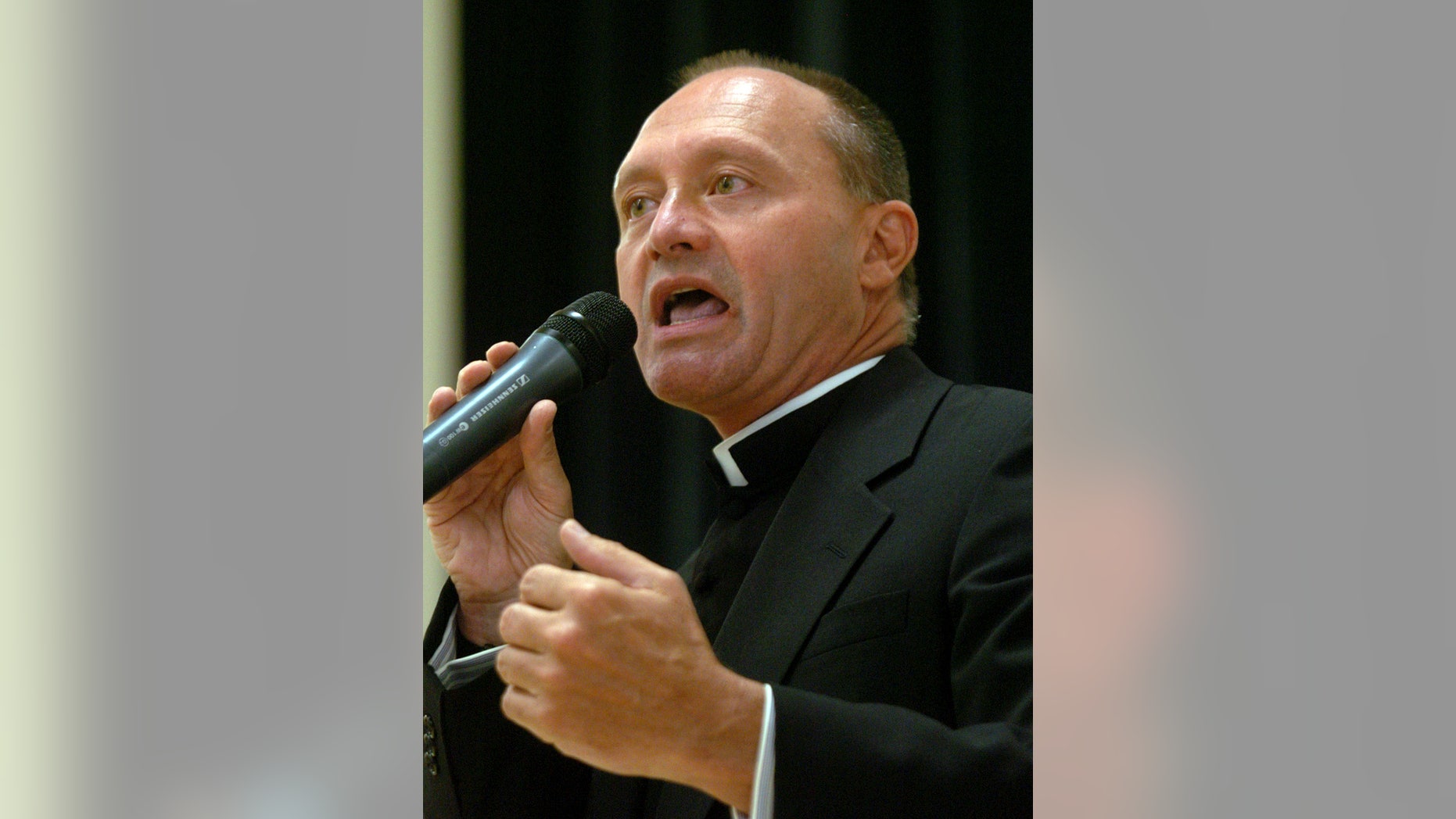 In this May 4, 2006 photo, Monsignor Kevin Wallin speaks at the Catholic Center, headquarters of the Diocese of Bridgeport, in Bridgeport, Conn.