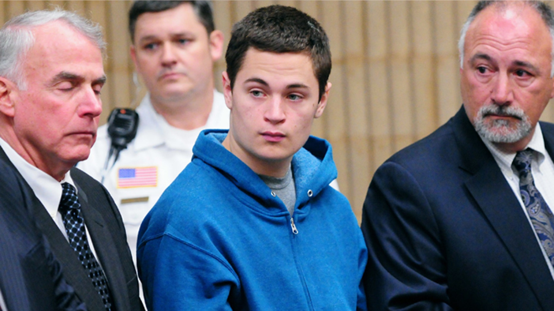 May 2: Christopher Plaskon, 16, second from right, stands with defense attorneys during his public court appearance in Milford, Conn.