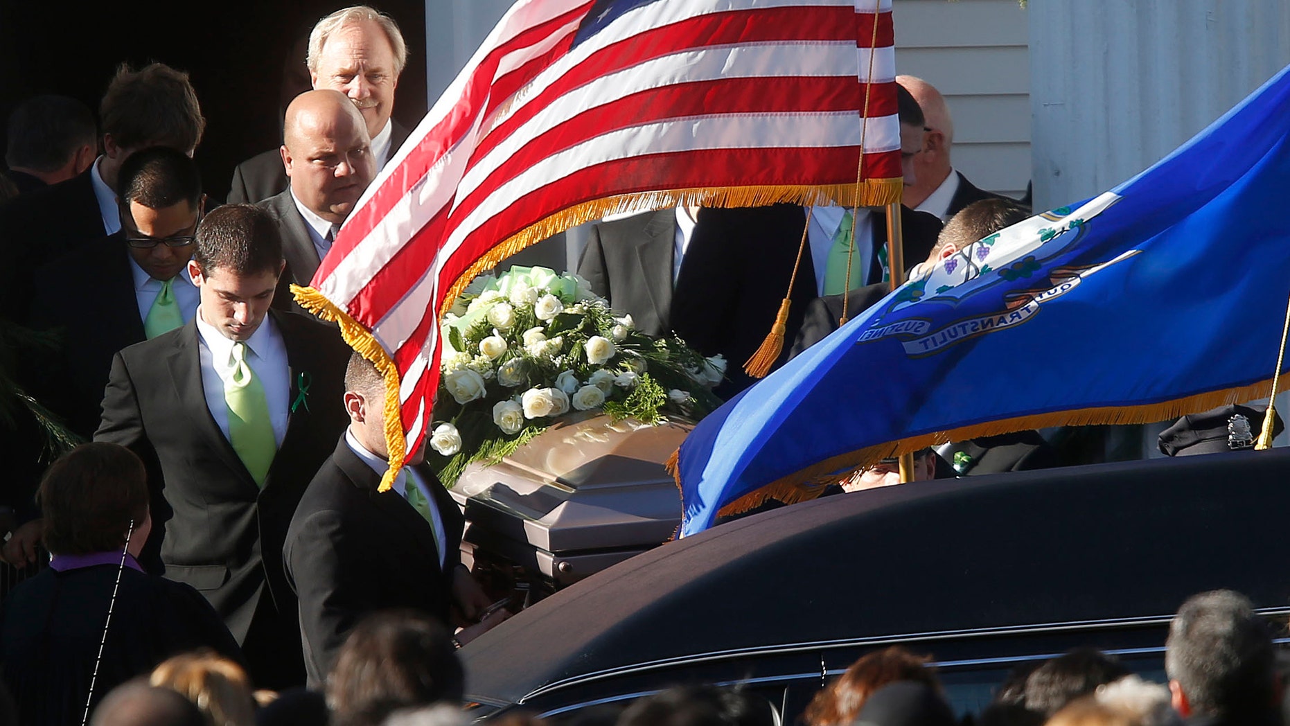 Dec. 19, 2012: A coffin bearing the body of Victoria Soto is carried out of Lordship Community Church after her funeral service in Stratford, Conn.