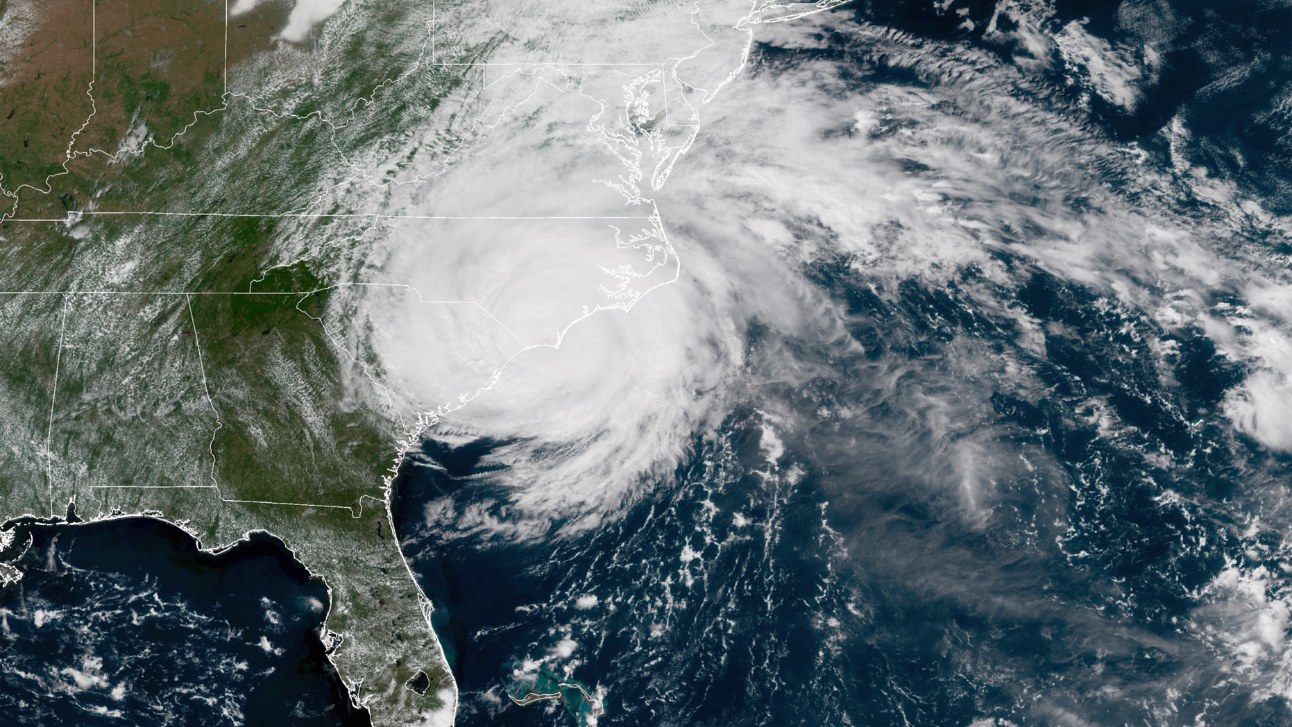 This satellite image provided by NOAA shows Hurricane Florence on the eastern coast of the United States on Friday, Sept. 14, 2018. (NOAA via AP)