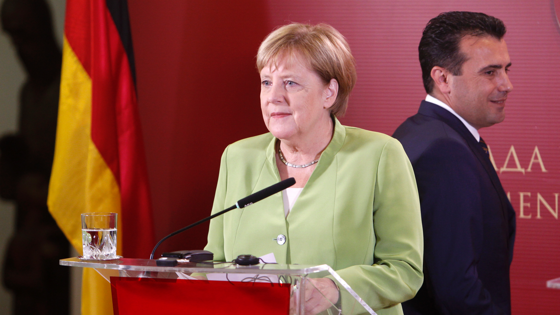 German Chancellor Angela Merkel and Macedonian Prime Minister Zoran Zaev, right, arrive for a news conference following their talks at the government building in Skopje, Macedonia, Saturday, Sept. 8, 2018. German chancellor Angela Merkel is a third western leader this week who has urged Macedonians to back massively the referendum on a deal with neighboring Greece aimed at ending a decades-old name dispute. (AP Photo/Boris Grdanoski)