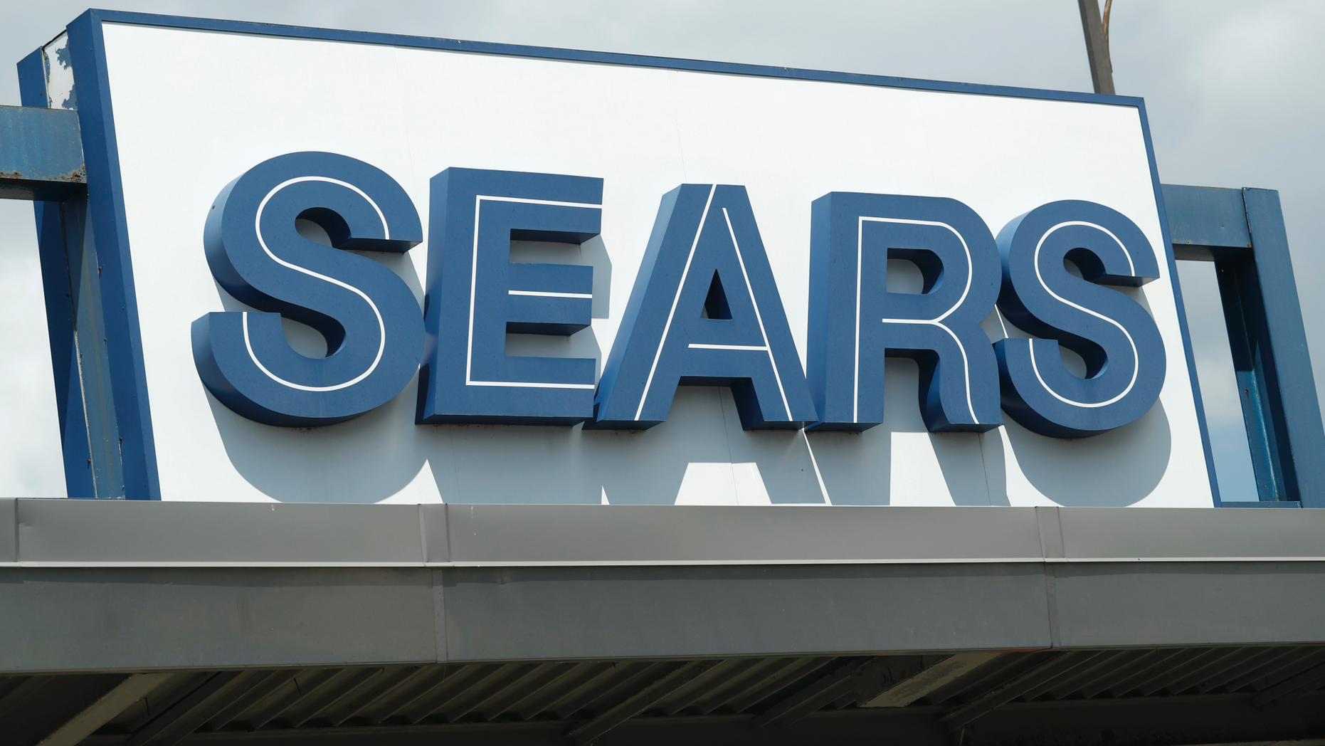 In this Saturday, July 21, 2018, photo the outdoor sign stands in the parking lot of a Sears department store in Saint Paul, Minn. Sears Holdings Corp. reports earns Thursday, Sept. 13. (AP Photo/David Zalubowski)