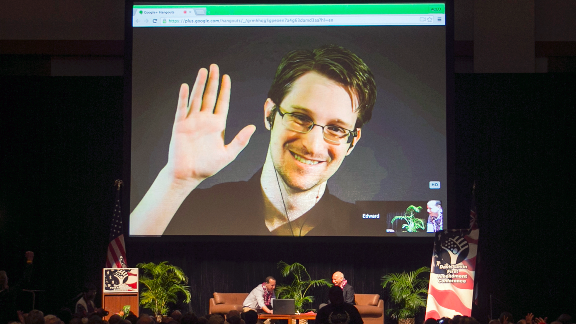 FILE - In this Feb. 14, 2015, file photo, Edward Snowden appears on a live video feed broadcast from Moscow at an event sponsored by ACLU Hawaii in Honolulu. Europe's human rights court is about to publish what could be a landmark ruling on the legality of mass surveillance. The case brought by civil liberties, human rights and journalism groups and campaigners challenges British surveillance and intelligence-sharing practices revealed by American whistleblower Edward Snowden. (AP Photo/Marco Garcia, File)
