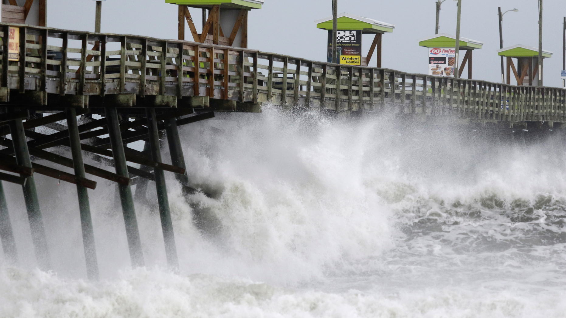 Waves from Hurricane Florence pound the Bogue Inlet Pier in Emerald Isle N.C., Thursday, Sept. 13, 2018. (AP Photo/Tom Copeland)