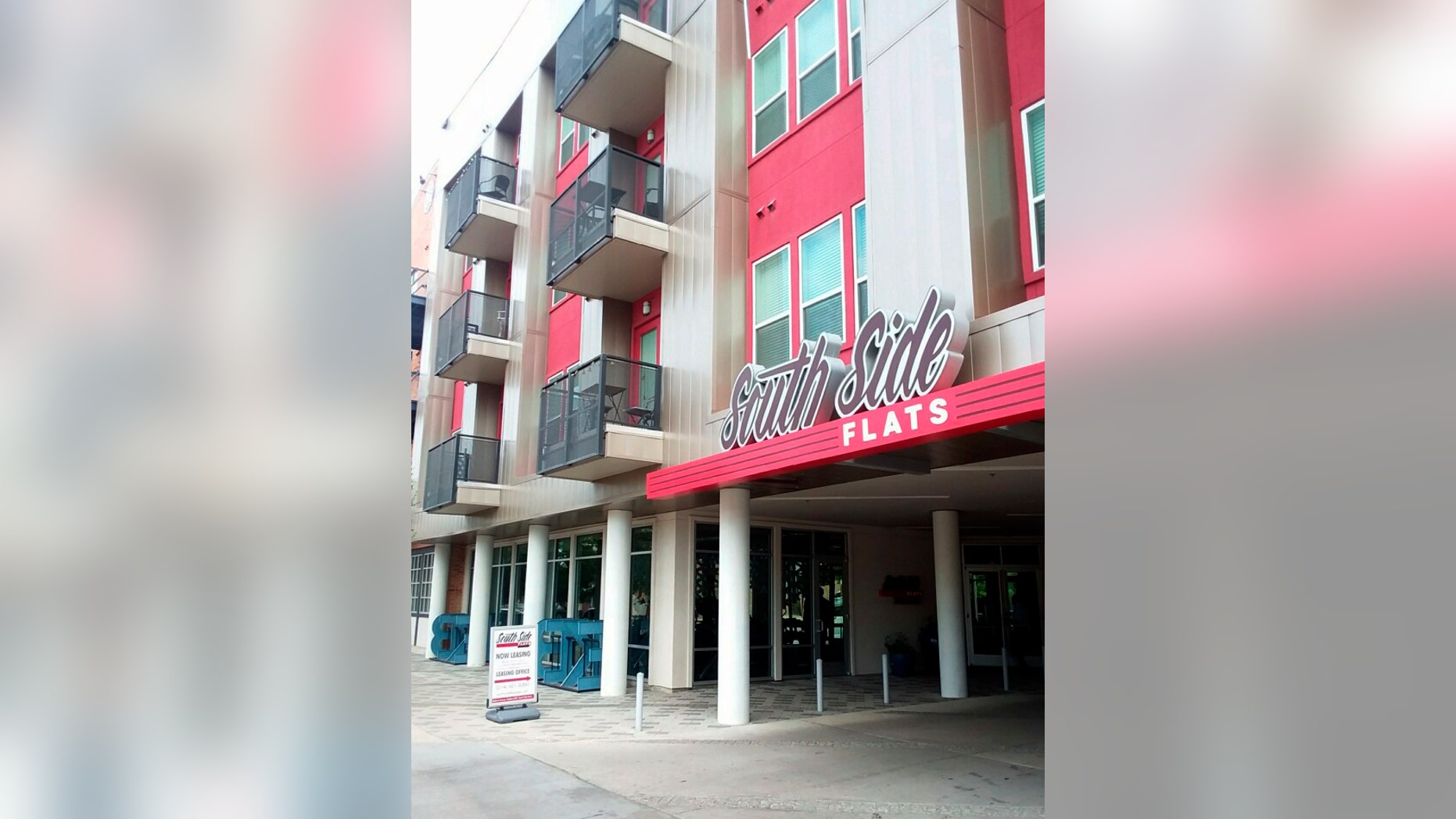 South Side Flats is shown in this Friday, Sept. 7, 2018 photo. A Dallas police officer returning home from work shot and killed a neighbor after she said she mistook his apartment for her own, authorities said Friday. The officer called dispatch to report that she had shot the man Thursday night, police said. She told responding officers that she believed the victim's apartment was her own when she entered it. (AP Photo/Ryan Tarinelli)