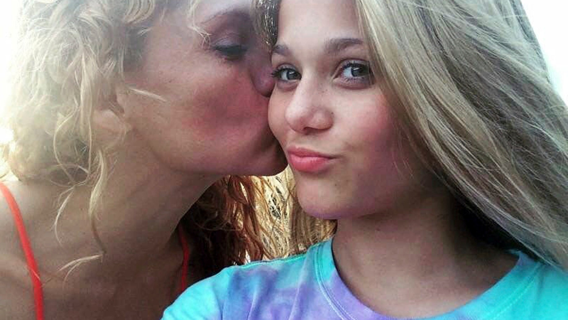 This undated photo shows Gabriella Green, 12, with her mother Tanya. Two 12-year-olds have been charged with cyberstalking in connection with Gabriella's death.