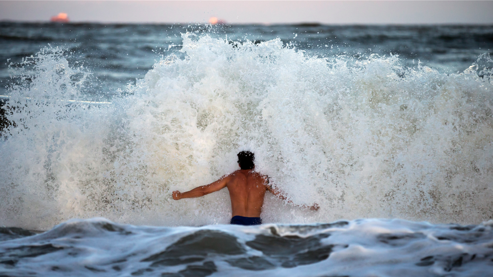 Body surfer Andrew Vanotteren, of Savannah, Ga., crashes into waves from Hurricane Florence, Wednesday, Sept., 12, 2018, on the south beach of Tybee Island, Ga. Vanotteren and his friend Bailey Gaddis said the waves have gotten bigger and better every evening as the storm approaches. (AP Photo/Stephen B. Morton, File)