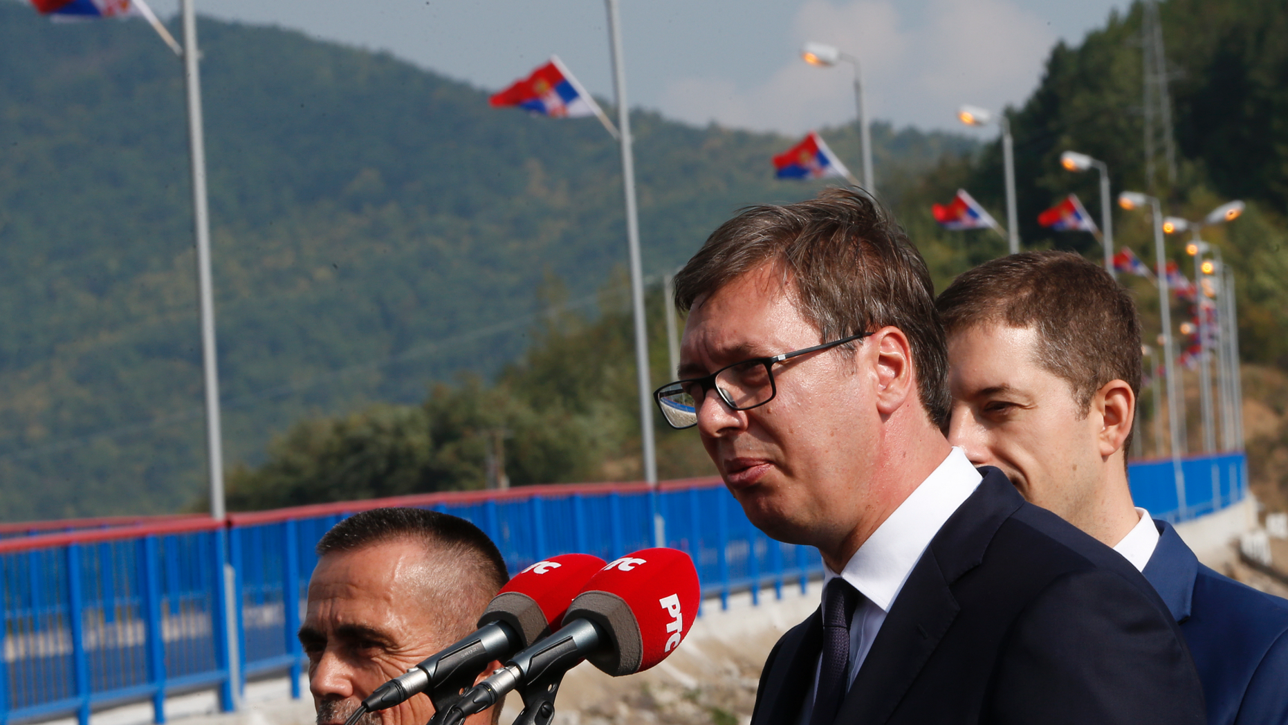 Serbian president Aleksandar Vucic, front, speaks during his visit to the Gazivode Dam near the village of Gazivode, Kosovo on Saturday, Sept. 8, 2018. Vucic is on a two day visit to Kosovo. (AP Photo/Visar Kryeziu)