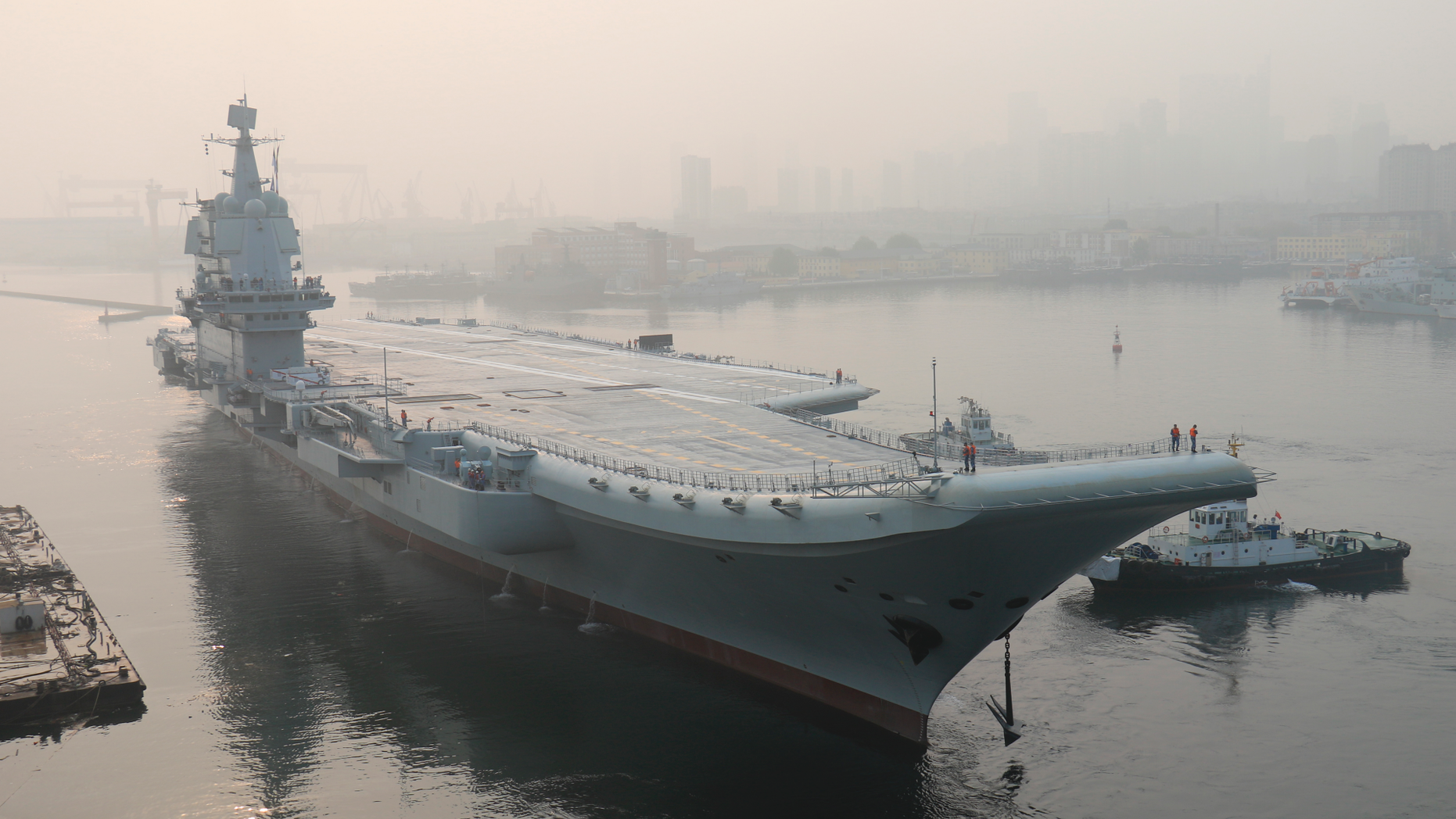 China's new unnamed home-built aircraft carrier leaves Dalian in northeast China's Liaoning Province for sea trials Sunday, May 13, 2018.