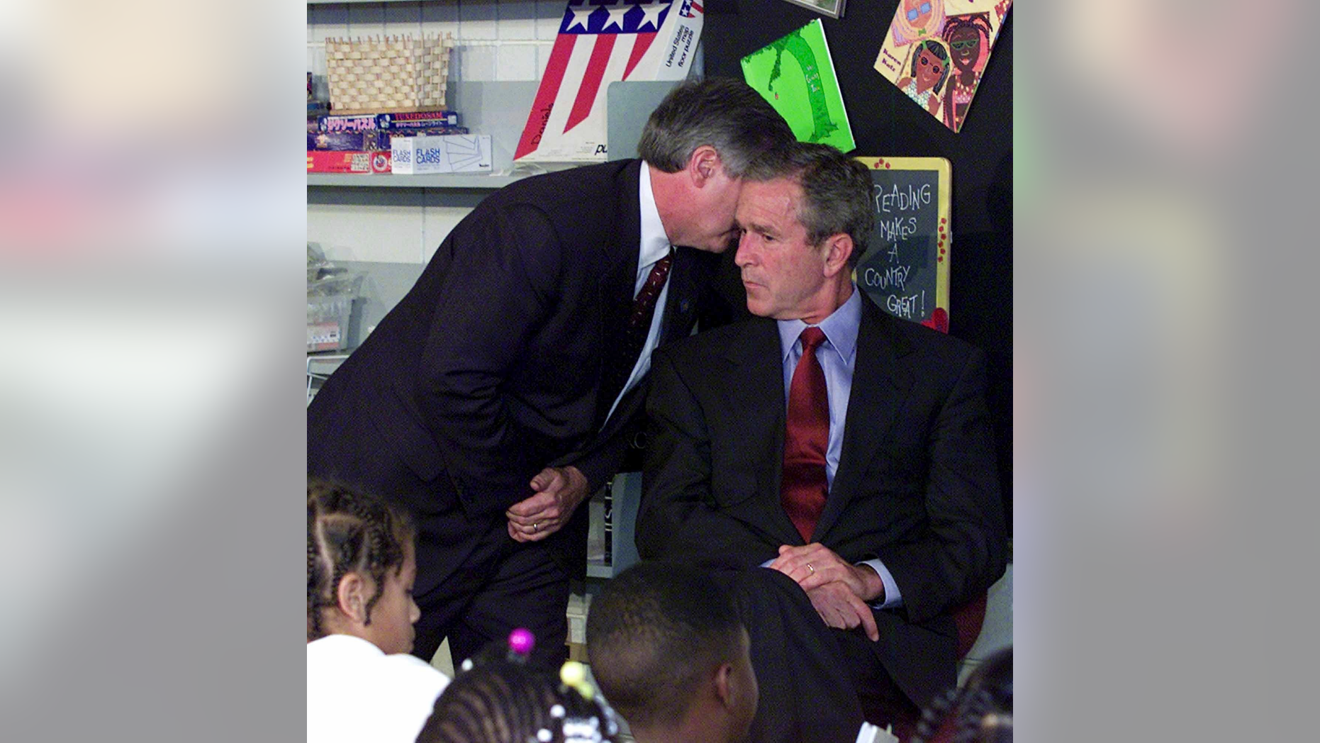 FILE - In this Tuesday, Sept. 11, 2001 file photo, Chief of Staff Andy Card whispers into the ear of President George W. Bush to give him word of the plane crashes into the World Trade Center, during a visit to the Emma E. Booker Elementary School in Sarasota, Fla. (AP Photo/Doug Mills, File)