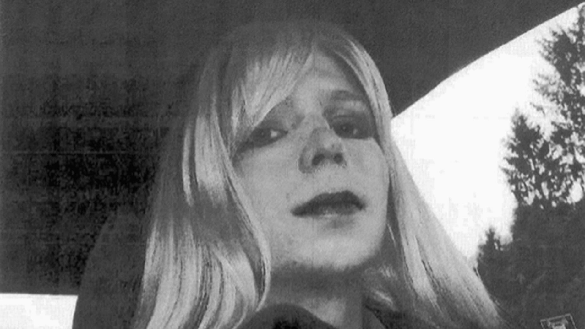 FILE - This undated file photo provided by the U.S. Army shows Pfc. Chelsea Manning wearing a wig and lipstick. Manning, a transgender soldier imprisoned for releasing classified military information, issued a statement Tuesday, May 9, 2017, ahead of her scheduled release May 17, from Fort Leavenworth, Kan., expressing gratitude to her supporters and to former President Barack Obama. Obama granted her clemency shortly before his term ended last year. (U.S. Army via AP, File)