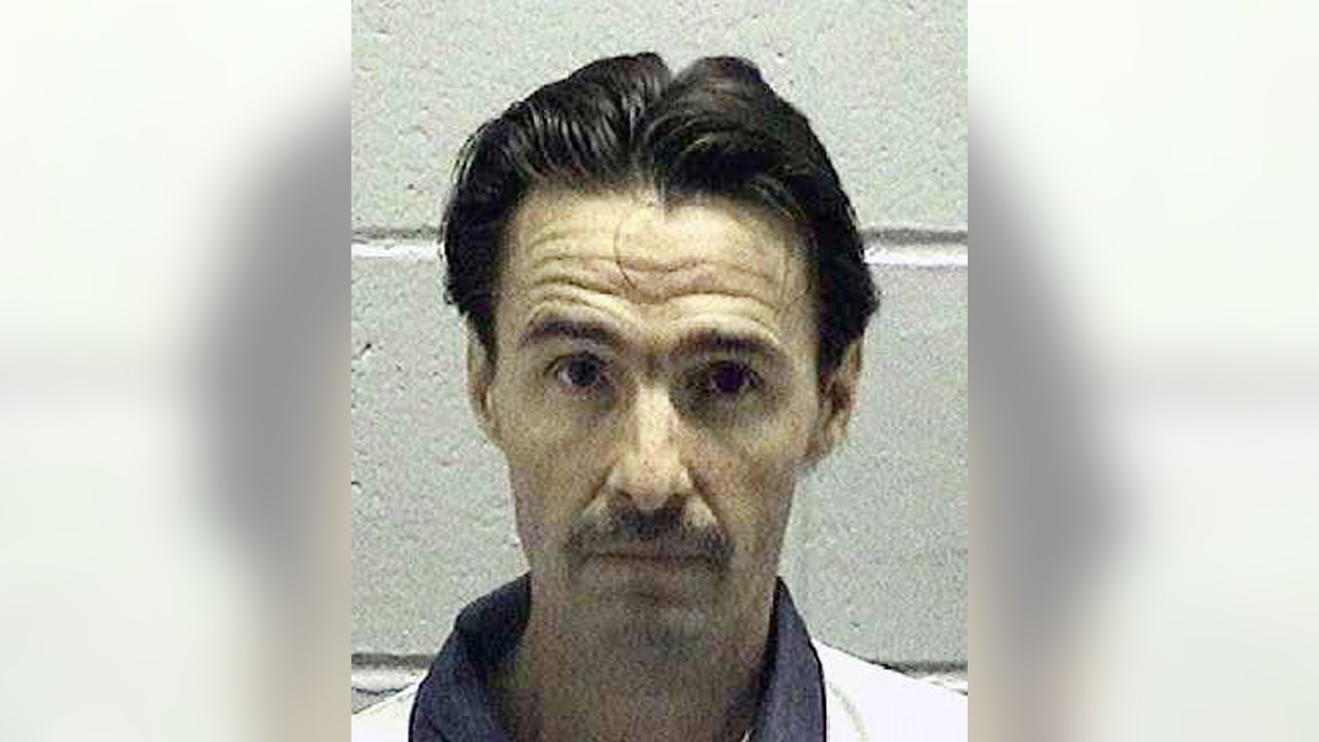 FILE - In this undated file photo released by the Georgia Department of Corrections, J.W. Ledford Jr., poses for a photo. Lawyers for Ledford, a Georgia death row inmate argue the state's lethal injection drug will cause him unconstitutional suffering and that execution by firing squad is the only appropriate alternative. J.W. Ledford Jr. is set to be put to death Tuesday, May 16, 2017, by injection of the barbiturate pentobarbital. (Georgia Department of Corrections via AP)