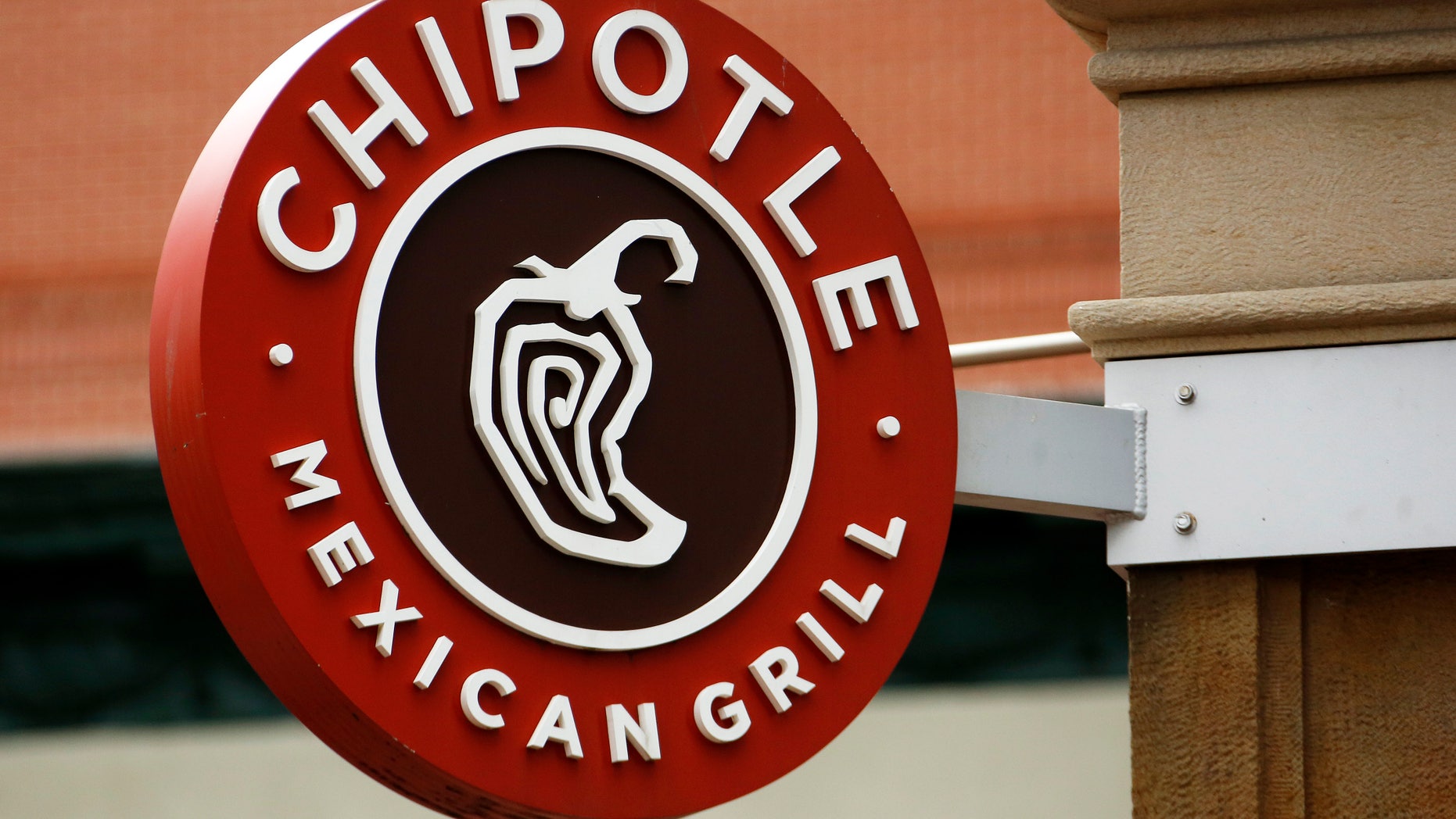 This Thursday, Jan. 12, 2017, photo shows the sign on a Chipotle restaurant in Pittsburgh. Chipotle Mexican Grill Inc. reports financial results, Tuesday, April 25, 2017. (AP Photo/Gene J. Puskar)