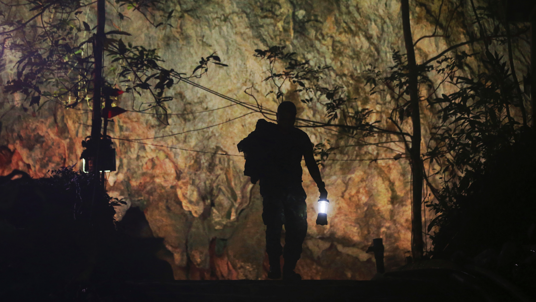 Netflix will be co-producing a miniseries about 12 youth soccer players and their coach who were trapped in a cave in Thailand for two weeks last summer, alongside SK Global. One of the rescuers is pictured in July 2018. (AP Photo/Sakchai Lali, File)