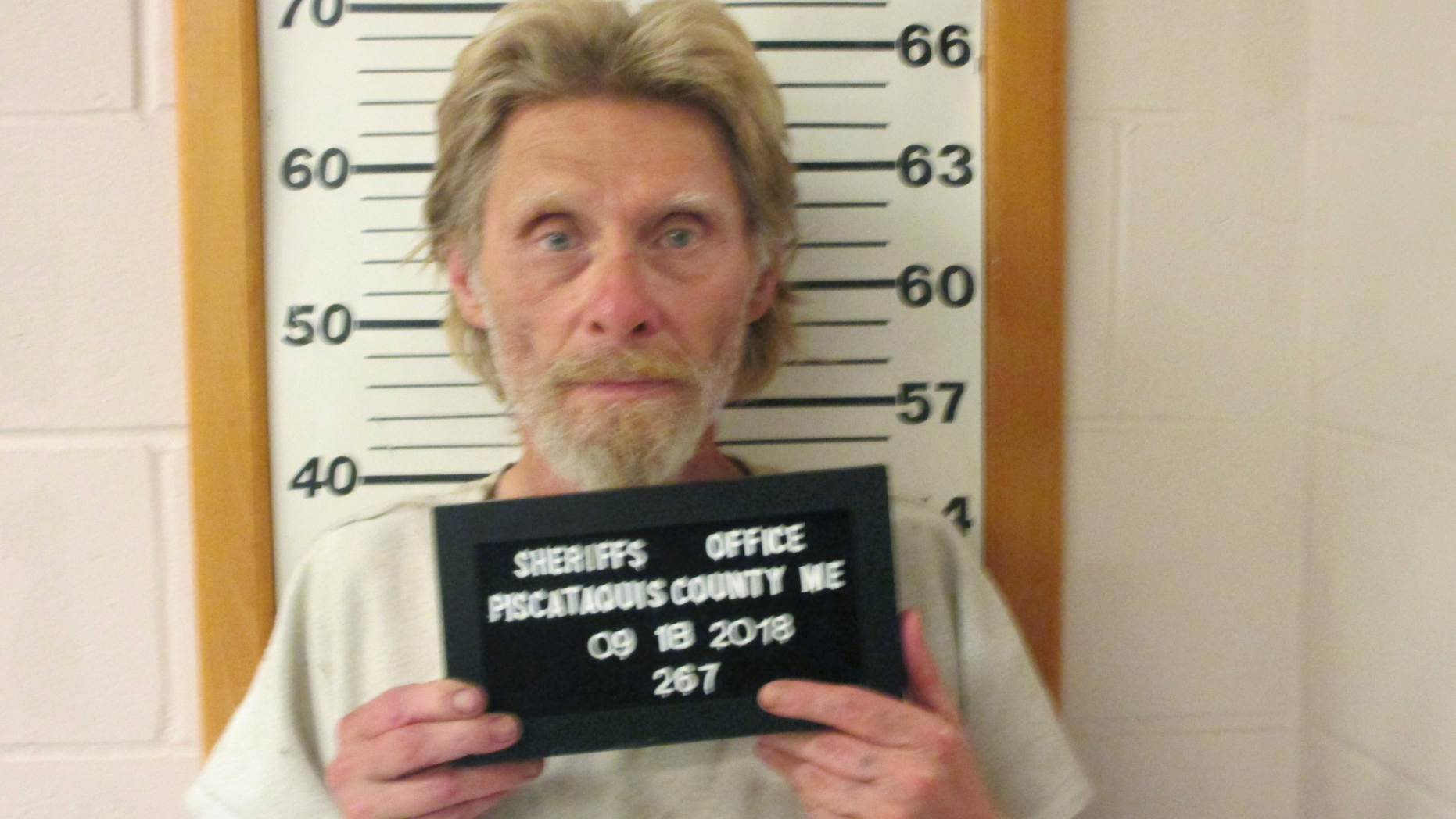 In this Tuesday, Sept. 18, 2018 photo provided by Piscataquis County Sheriff's Office, convicted murderer Arnold Nash stands for a booking photo, in Dover-Foxcroft, Maine. Nash was serving a 45-year sentence for killing his former neighbor in 1991. He previously escaped from Maine Correctional Center in Windham in 1973 and from the Maine State Prison in 1981. (Piscataquis County Sheriff's Office via AP)