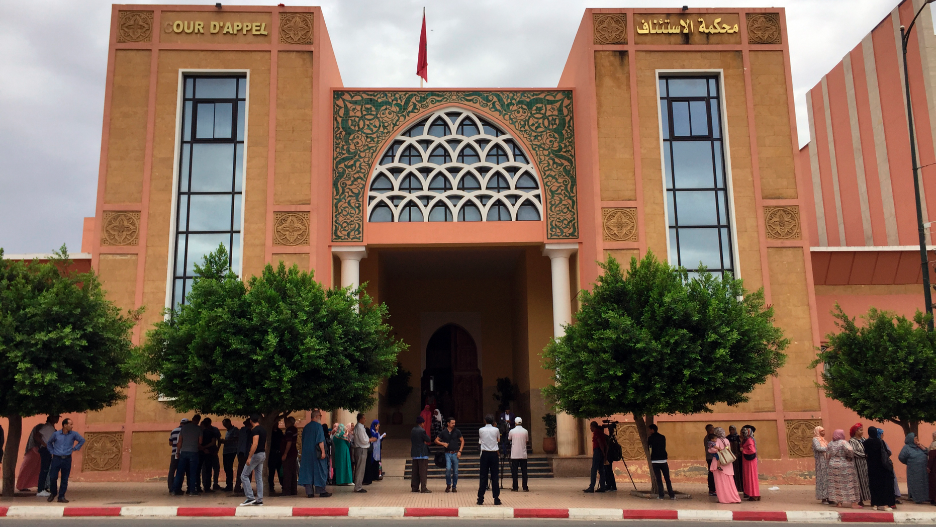 The courthouse of Beni Mellal, Morocco is pictured, Thursday, Sept. 6, 2018. Family members of a dozen young men suspected in the gang-rape, forcible tattooing and torture of a 17-year-old Moroccan girl, Khadija, allegedly held captive for two months made a ruckus outside the courtroom where an investigative judge held his first hearing in the case. (AP Photo/Nadine Achoui-Lesage)