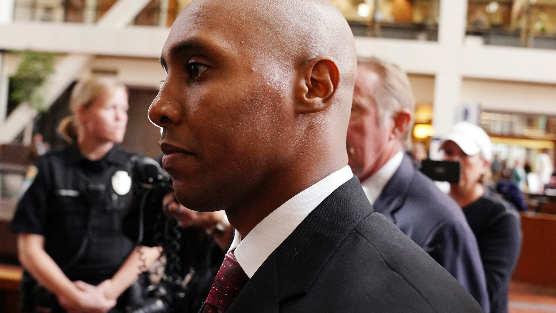 Mohamed Noor, center, accompanied by his legal team, Peter Wold and Tom Plunkett, arrive to argue pretrial motions at a probable cause hearing for the ex-Minneapolis police officer Thursday, Sept. 27, 2018 at the Hennepin County Government Center in Minneapolis. (Anthony Souffle/Star Tribune via AP)