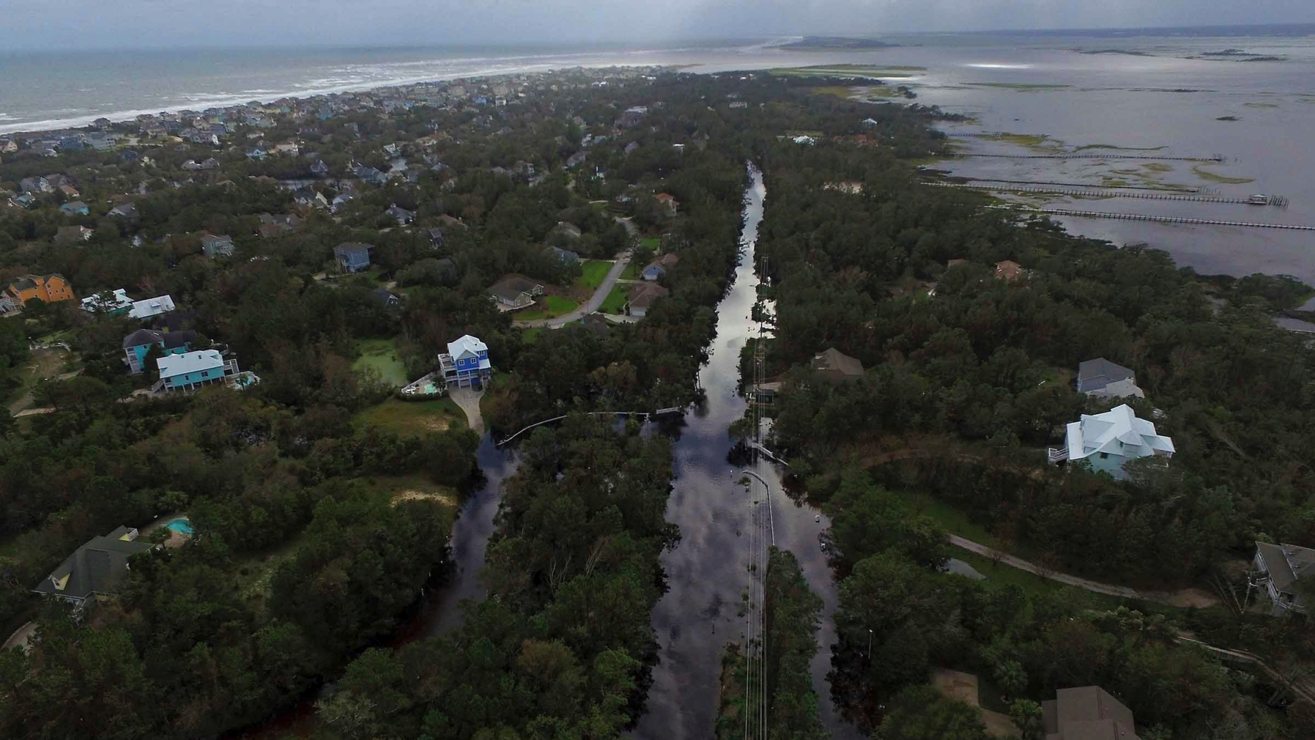 Coast Guard Road leading to the south end of Emerald Isle is seen after Hurricane Florence hit Emerald Isle, N.C., Sunday, Sept. 16, 2018. (AP Photo/Tom Copeland)