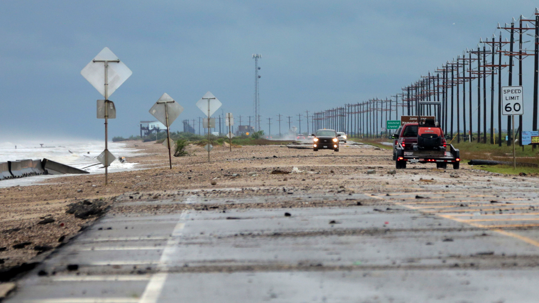 Sydney Schultz takes photos of waves crashing next to Rollover Pass as Tropical Storm Cindy approaches the coast on the Bolivar Peninsula, June 21.