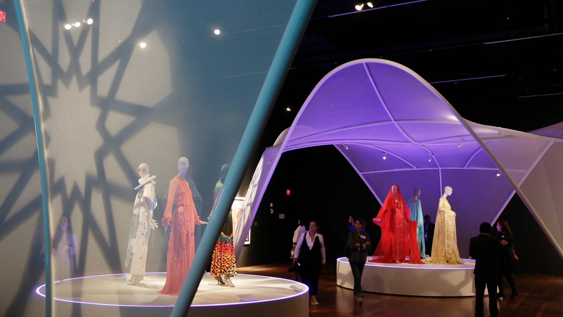 In this photo taken Thursday, Sept. 20, 2018, is the exhibit Contemporary Muslim Fashions at the M. H. de Young Memorial Museum in San Francisco. The first major museum exhibition of contemporary Muslim women's fashion reflects designs from around the world that are vibrant and elegant, playful and diverse. The exhibit opens on Saturday. (AP Photo/Eric Risberg)