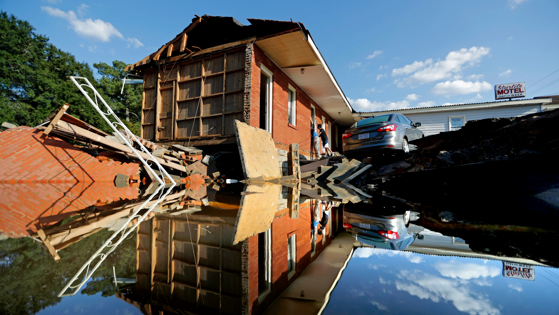 Part of the Starlite Motel is washed away in the aftermath of flooding from Hurricane Florence in Spring Lake, N.C., Wednesday, Sept. 19, 2018. (AP Photo/David Goldman)