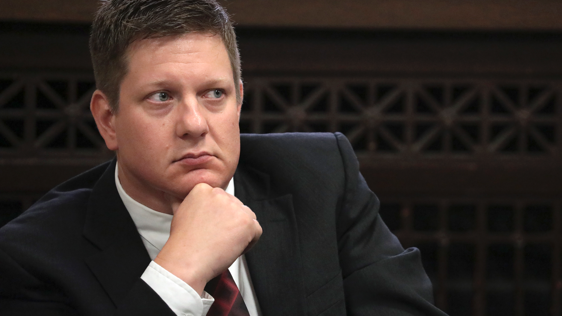 FILE - In this Thursday, Sept. 6, 2018, file photo, Chicago police Officer Jason Van Dyke, charged with first-degree murder in the shooting of black teenager Laquan McDonald in 2014, listens during a hearing at the Leighton Criminal Court Building in Chicago. Jury selection is expected to resume for the trial of Van Dyke after the effort was called off Tuesday, Sept. 11, 2018, due to a scheduling conflict for the trial's presiding Judge Vincent Gaughan. Van Dyke has pleaded not guilty. (Antonio Perez/Chicago Tribune via AP, Pool, File)