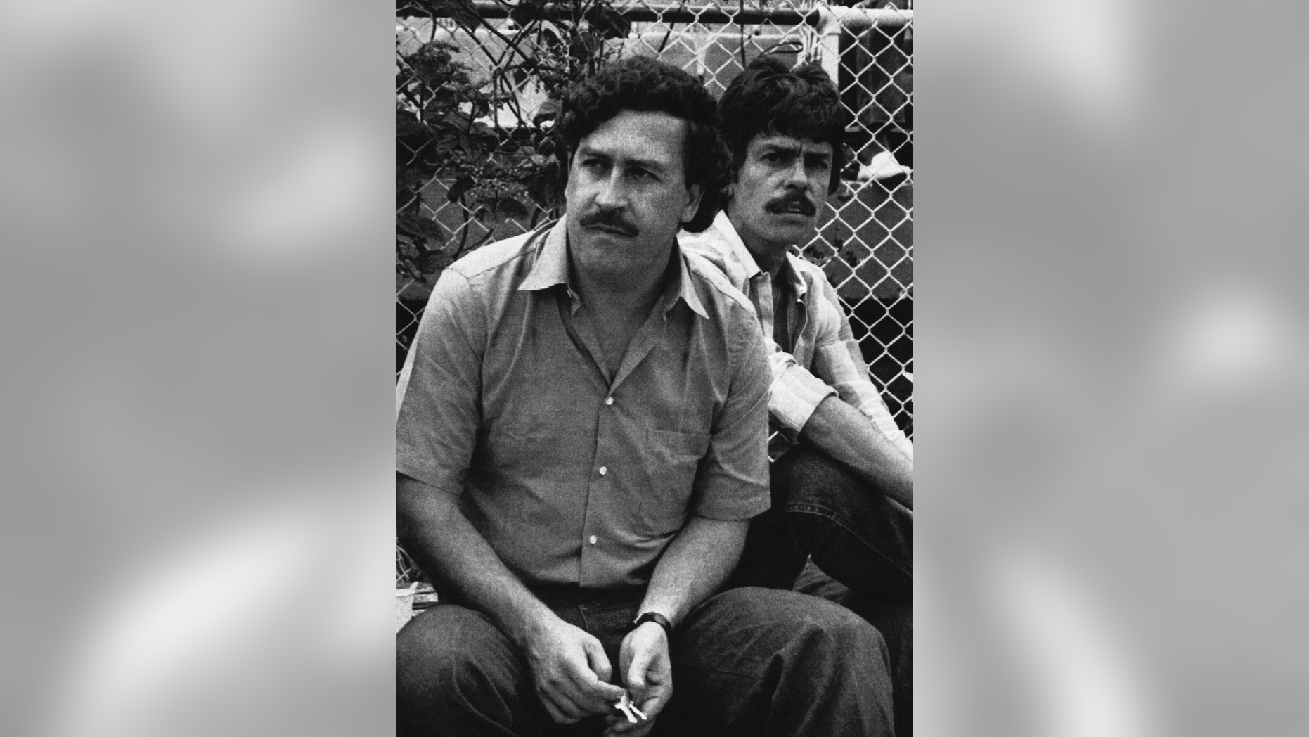 FILE - In this 1983 file photo, Medellin drug cartel boss Pablo Escobar watches a soccer game in Medellin, Colombia. Colombian police announced Thursday, Sept. 20, 2018 that they have shut down a small makeshift museum that showcased the life and times of notorious drug lord, saying the building's managers do not have a tourism license. The site was managed by Escobar's 71-year-old brother, Roberto. (AP Photo, File)