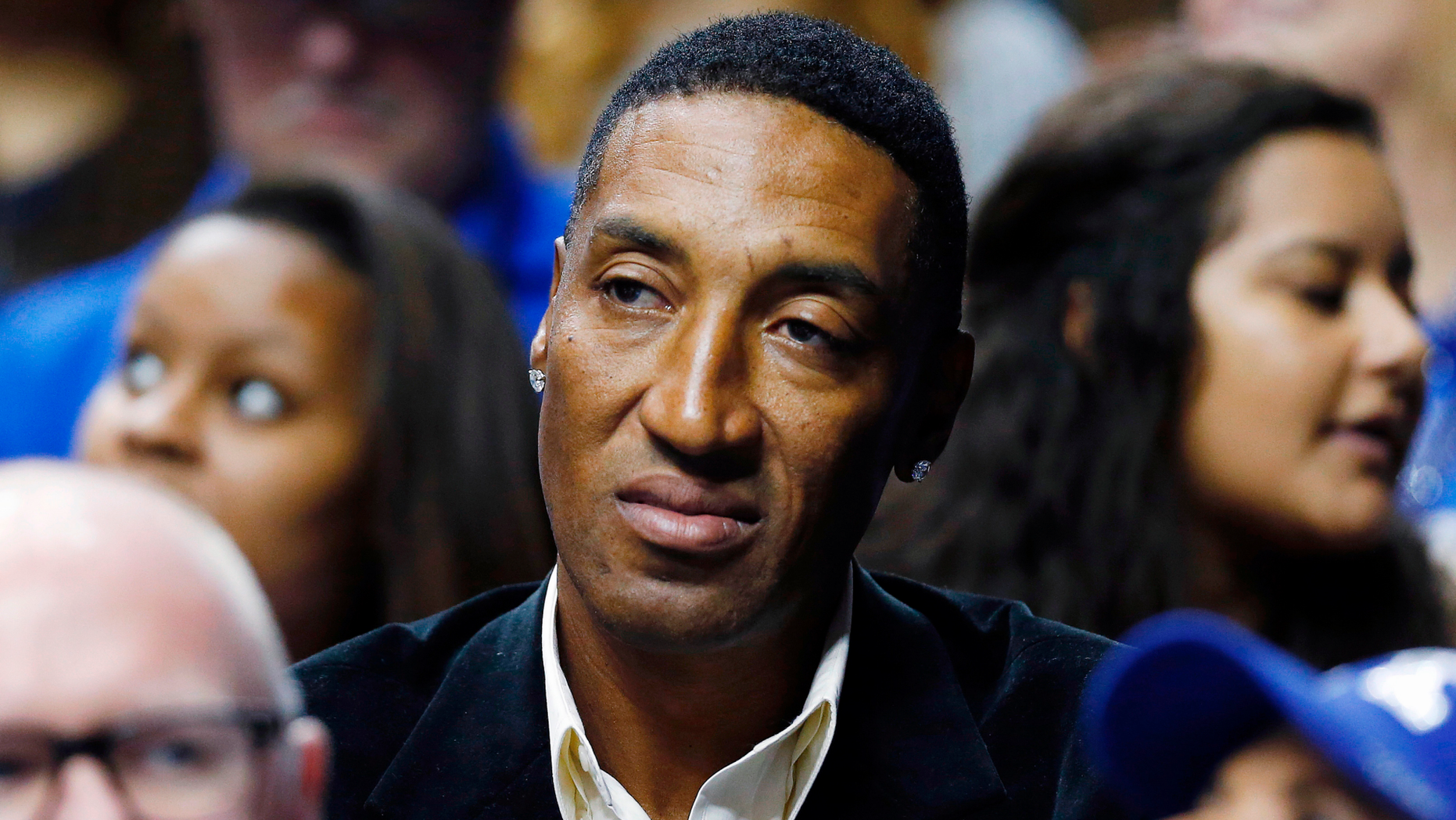 Former NBA player Scottie Pippen watches an NCAA college basketball game in 2015.