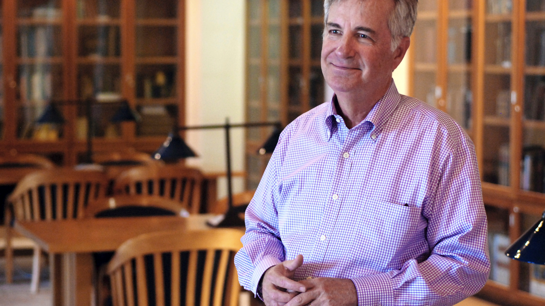 In this Tuesday, Sept. 11, 2018, photo, St. John's College President Mark Roosevelt talks about trends in student tuition and spending by colleges in Santa Fe, N.M. The college with campuses in Santa Fe and Annapolis, Md., is reducing its annual tuition price, adding grants for New Mexico residents and plans to rely more on philanthropy to defer academic costs to students. (AP Photo/Morgan Lee)