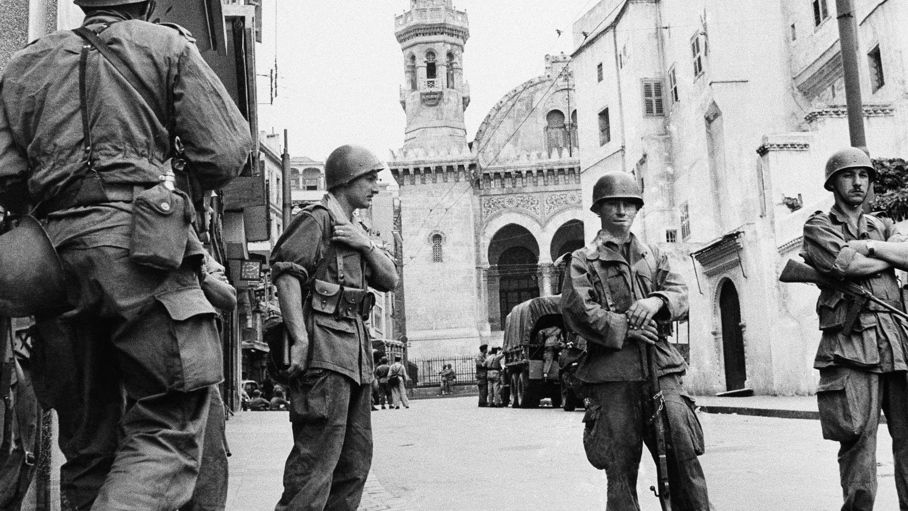 FILE - In this May 27, 1956 file photo, French troops seal off Algiers' notorious casbah, 400-year-old teeming Arab quarter. French President Emmanuel Macron has formally recognized that the French state was responsible for the death of a dissident mathematician in Algeria in 1957, admitting for the first time the French military's "system" of torture during Algeria's independence war. (AP Photo)