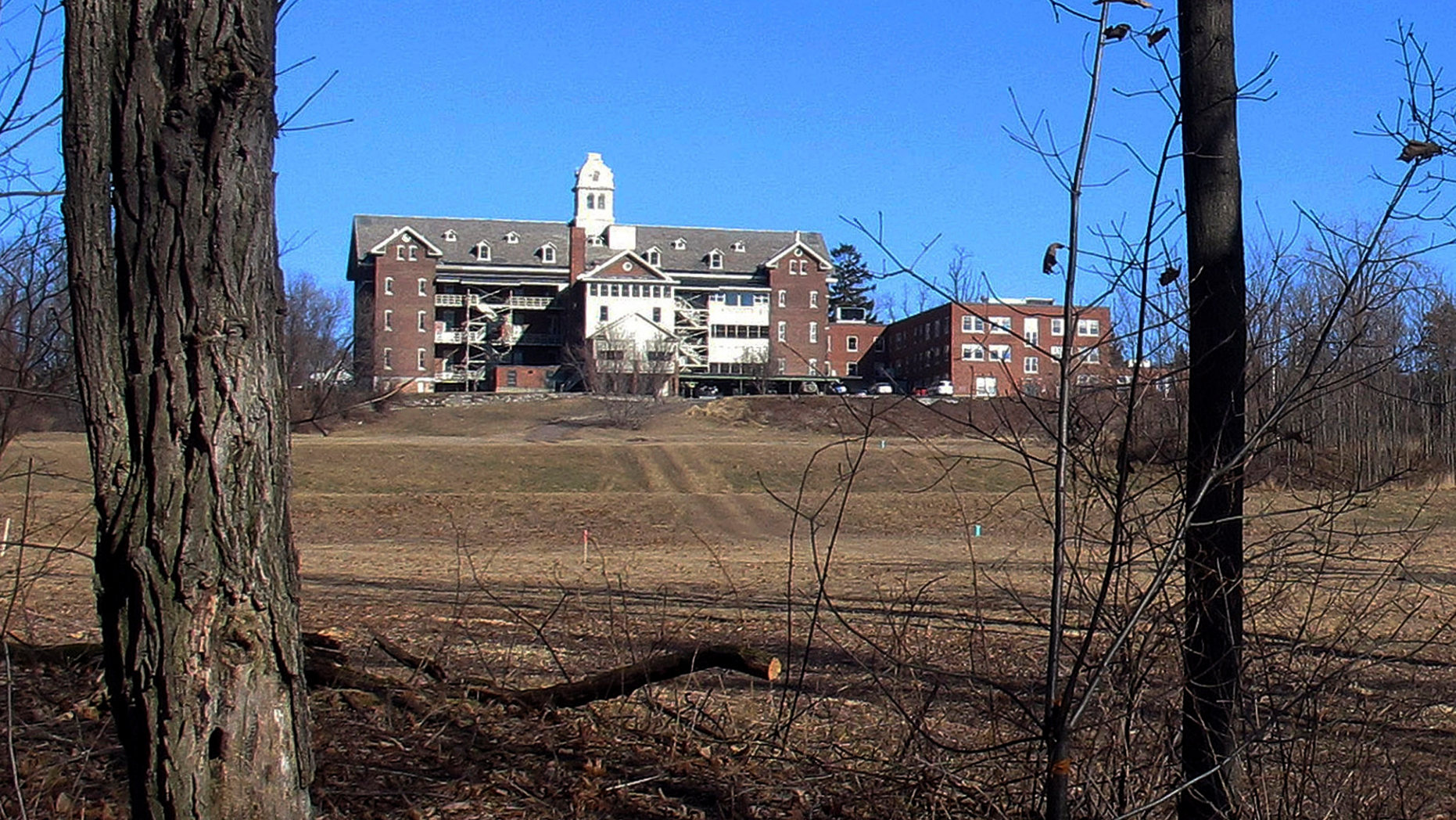 FILE - This Feb. 22, 2015, file photo shows buildings and property of Burlington College in Burlington, Vt. Prior to housing the college, the building was home to St. Joseph's Orphanage. Vermont Attorney General T.J. Donovan said Monday, Sept. 10, 2018, a task force is being launched to investigate abuse allegations at the orphanage, which closed in 1974. The Roman Catholic bishop of Burlington said the diocese will cooperate. (AP Photo/Wilson Ring, File)