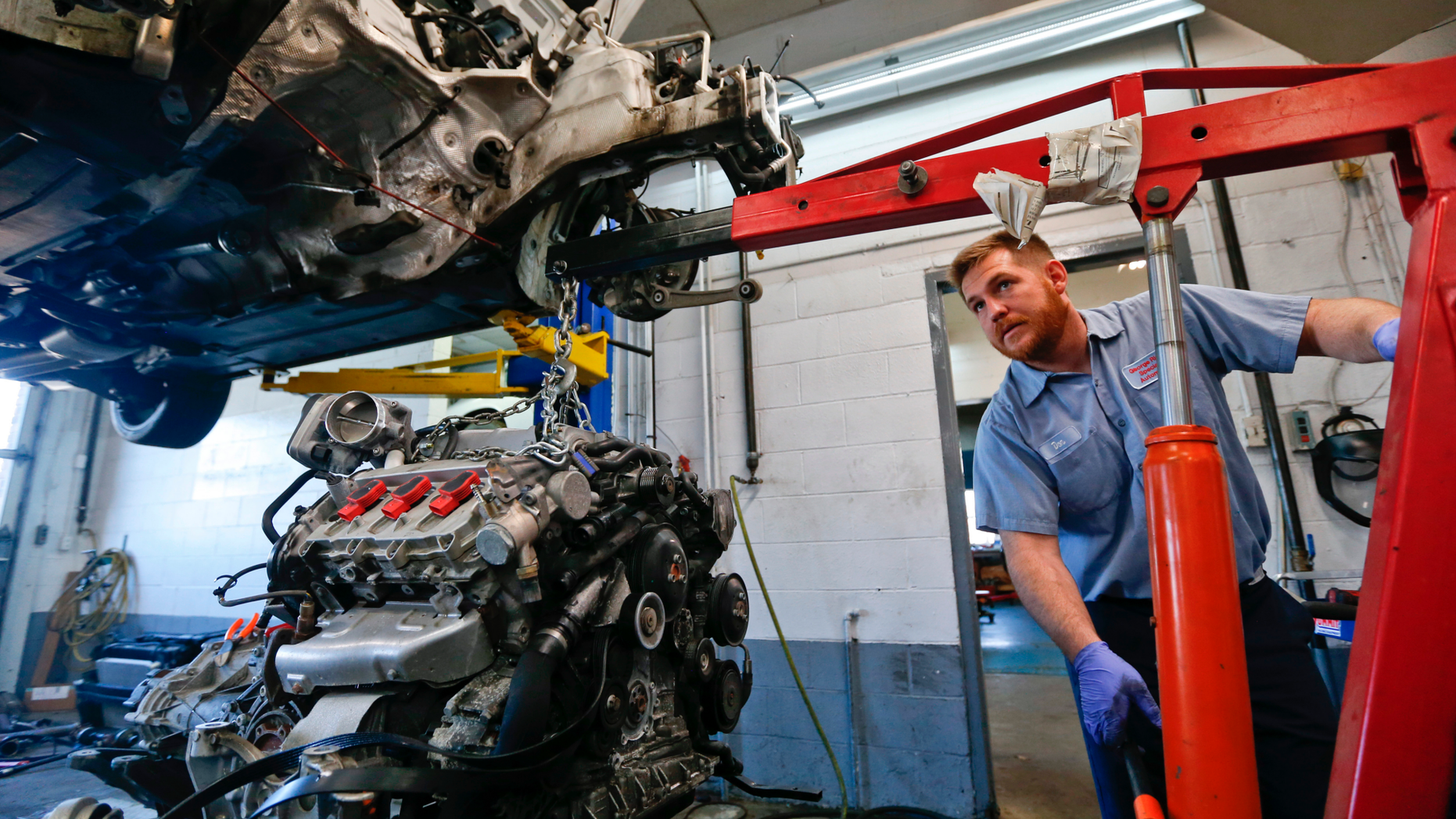 In this April 26, 2018, photo automotive technician Don Dimond prepares to separate an engine and transmission assembly at a repair shop in Harmony, Pa. On Thursday, Sept. 6, the Institute for Supply Management, a trade group of purchasing managers, issues its index of non-manufacturing activity for August. (AP Photo/Keith Srakocic)