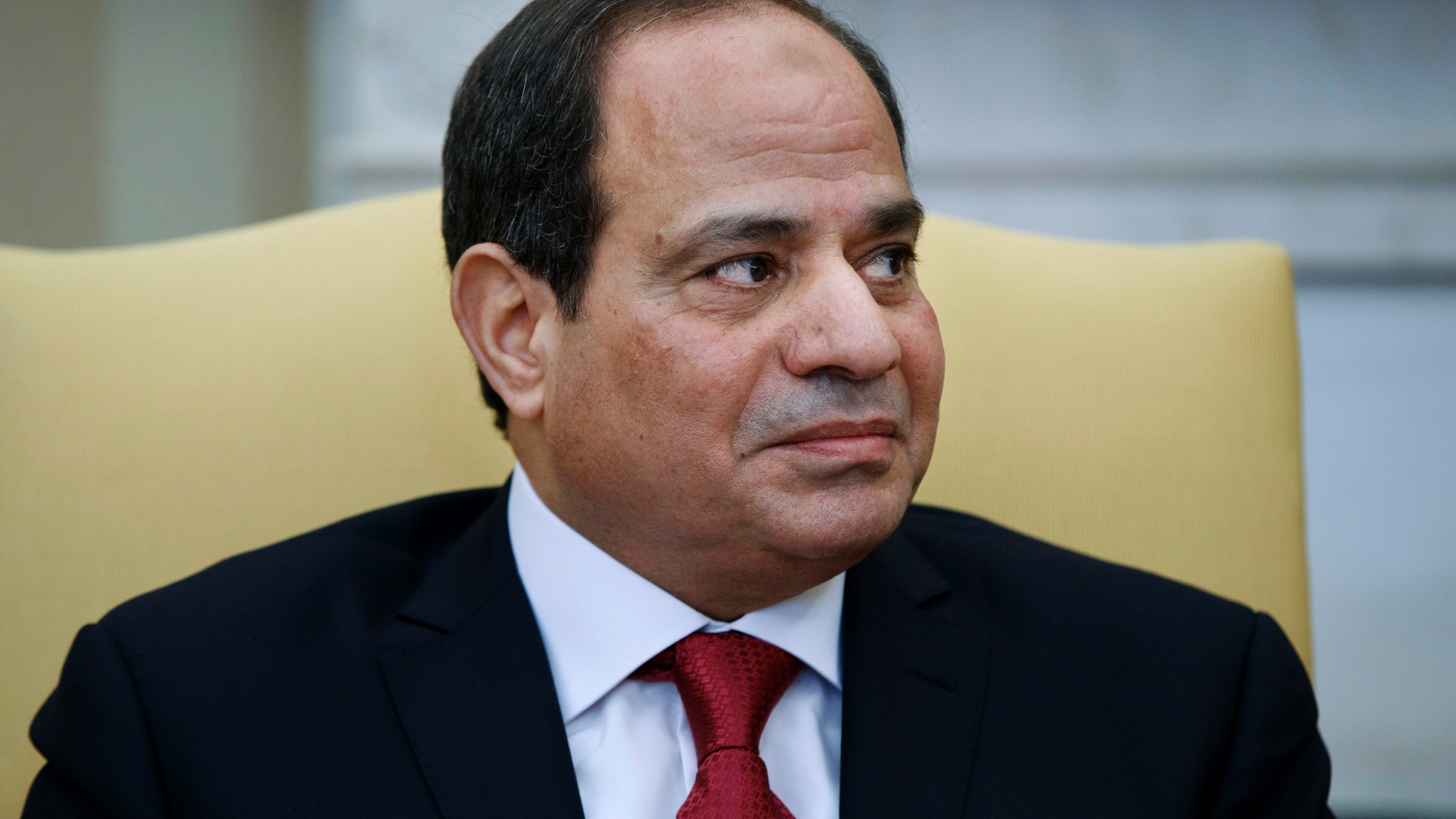 FILE - In this April 3, 2017 file photo, Egyptian President Abdel-Fattah El-Sissi listens during a meeting with President Donald Trump in the Oval Office of the White House in Washington. Echoing Trump’s rhetoric, authorities in Egypt are taking aim at an alleged barrage of “fake news” they say is meant to sow division and undermine the rule of general-turned-president el-Sissi. Government critics denounce the measures as the latest attempt to suppress dissent and silence what is left of independent journalism. (AP Photo/Evan Vucci, File)