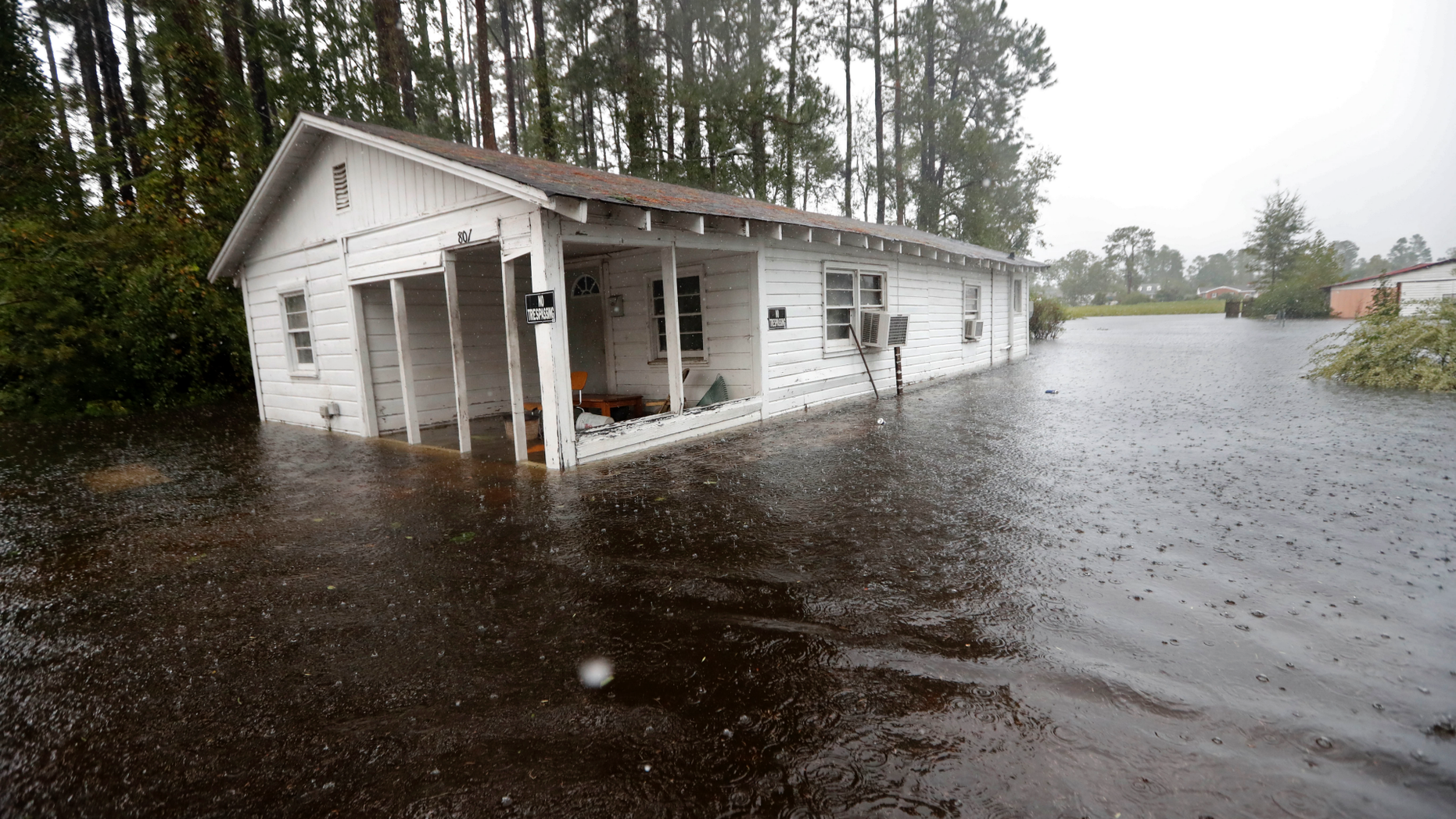 A home is seen in floodwaters from Hurricane Florence in Marion, S.C., Sunday, Sept. 16, 2018. (AP Photo/Gerald Herbert)