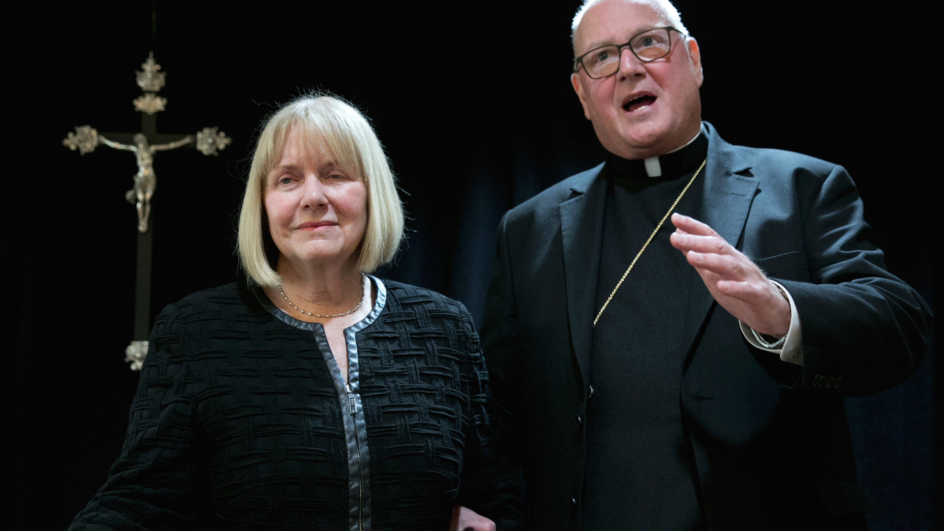 Cardinal Timothy Dolan addresses a news conference at the offices of the New York Archdiocese, in New York, Thursday, Sept. 20, 2018. The Roman Catholic Archdiocese of New York said Thursday that it has hired former federal judge Barbara Jones, left, to review its procedures and protocols for handling allegations of sexual abuse. (AP Photo/Richard Drew)