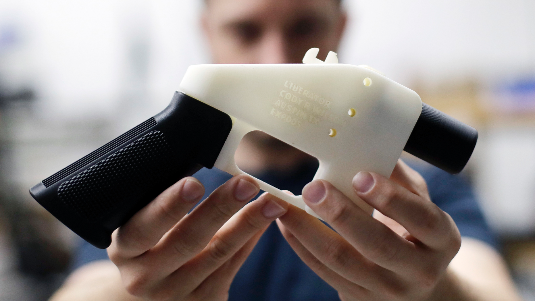FILE - In this Aug. 1, 2018, file photo, Cody Wilson, with Defense Distributed, holds a 3D-printed gun called the Liberator at his shop in Austin, Texas. Police allege in an affidavit filed Wednesday, Sept. 19, that Wilson had sex with an underage girl and paid her $500 afterward. Austin police Detective Shaun Donovan wrote in a request for a warrant to arrest Wilson on a sexual assault charge. The court filing doesn't say how old the girl is, but Texas' age of consent is 17. (AP Photo/Eric Gay, File)