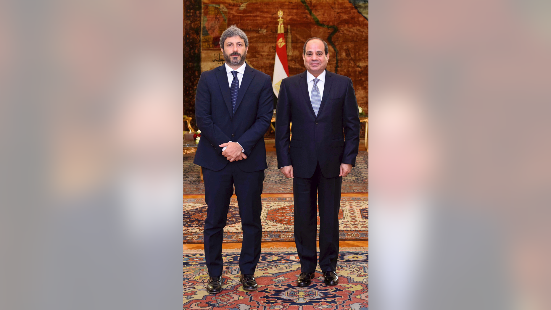 In this photo released by the Egyptian Presidency, Egyptian President Abdel-Fattah el-Sissi, right, poses for a photo with Roberto Fico, president of Italy's Chamber of Deputies, at the presidential palace in Cairo, Egypt, Monday, Sept. 17, 2018. Fico said a final resolution of the 2016 killing of a graduate student in Egypt will help boost relations between the two nations. A presidential statement said el-Sissi assured Fico of his nation's commitment to "full transparency" in its cooperation with Italy on the case. (Egyptian Presidency via AP)
