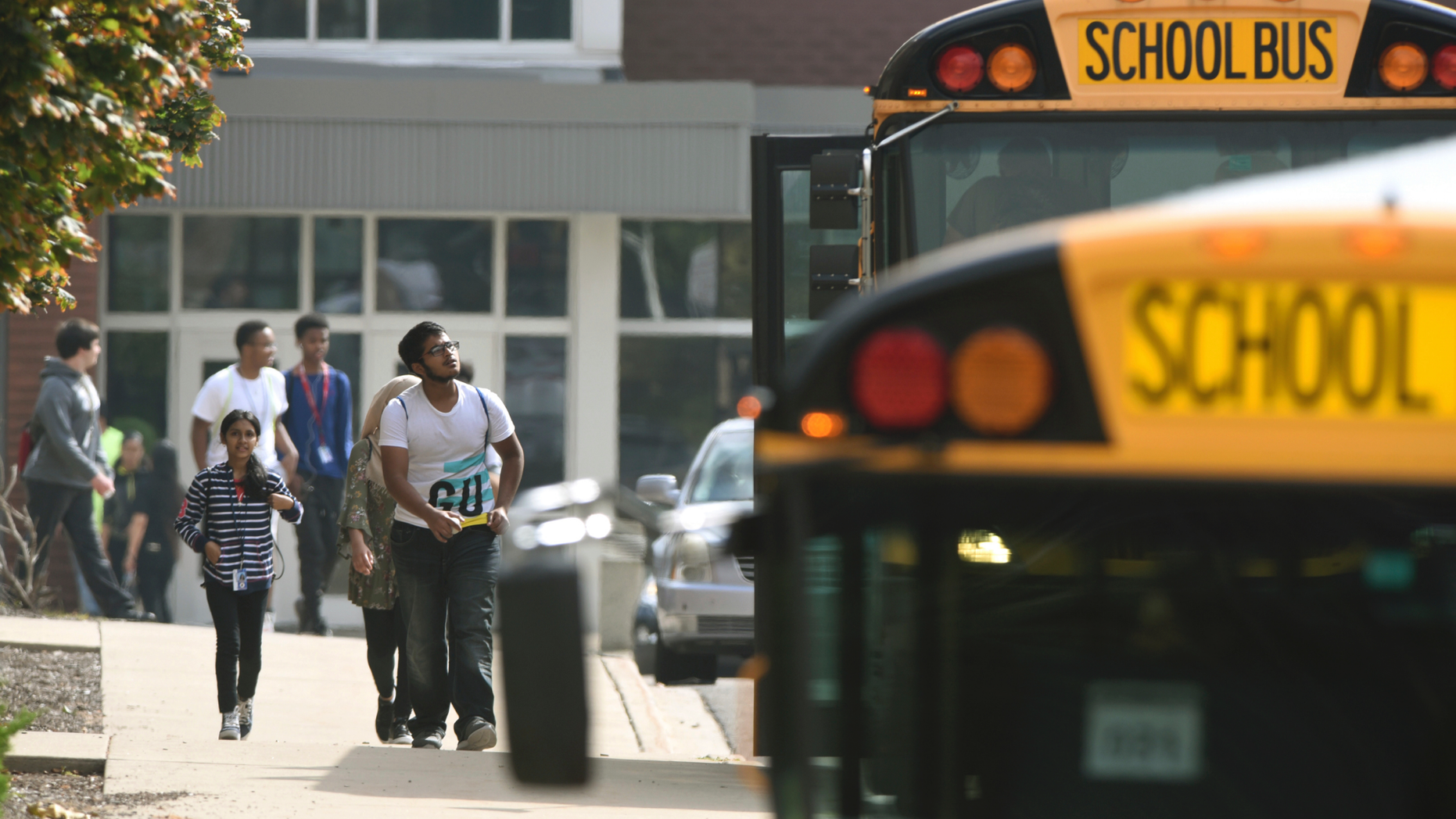 Warren Fitzgerald High School students are released from lockdown after a student was stabbed on campus Wednesday, Sept. 12, 2018, in Warren, Mich. (Max Ortiz/Detroit News via AP)