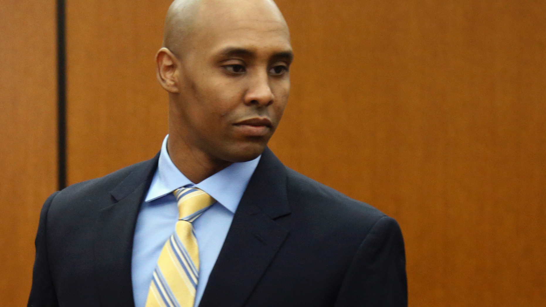 FILE - In this May 8, 2018, file photo, former Minneapolis police officer Mohamed Noor arrives at the Hennepin County Government Center for a hearing in Minneapolis. Noor is charged in the July 2017 shooting death of Justine Ruszczyk Damond, of Australia, who had called 911 to report a possible assault. Court records show psychiatrists and training officers voiced concerns about Noor's fitness for duty long before he fatally shot Damond. (AP Photo/Jim Mone, File)
